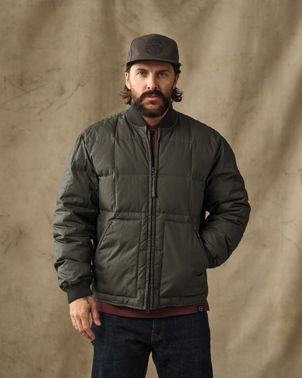 image of a model wearing Filson's Heritage Cotton Down Jacket - Beluga