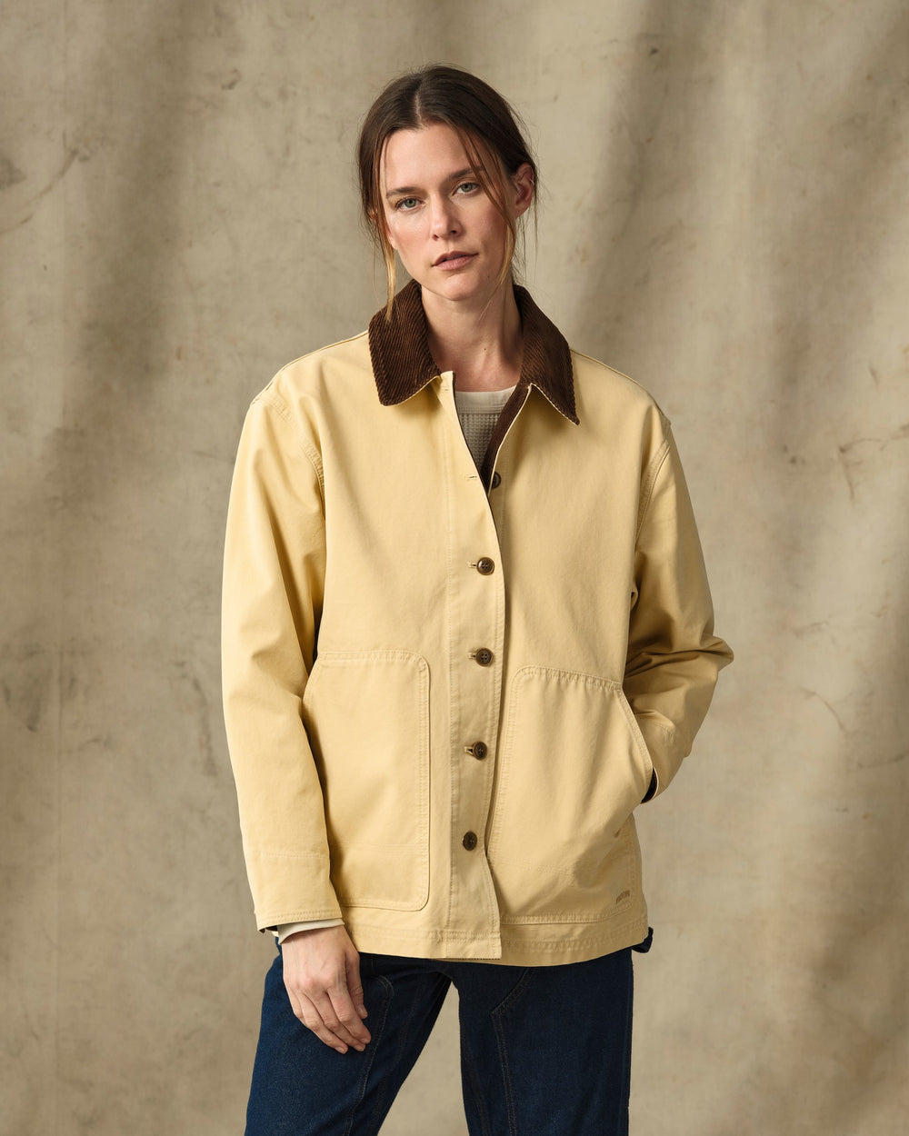 image of a model wearing Filson's Women's Canvas Barn Coat - Antique Khaki