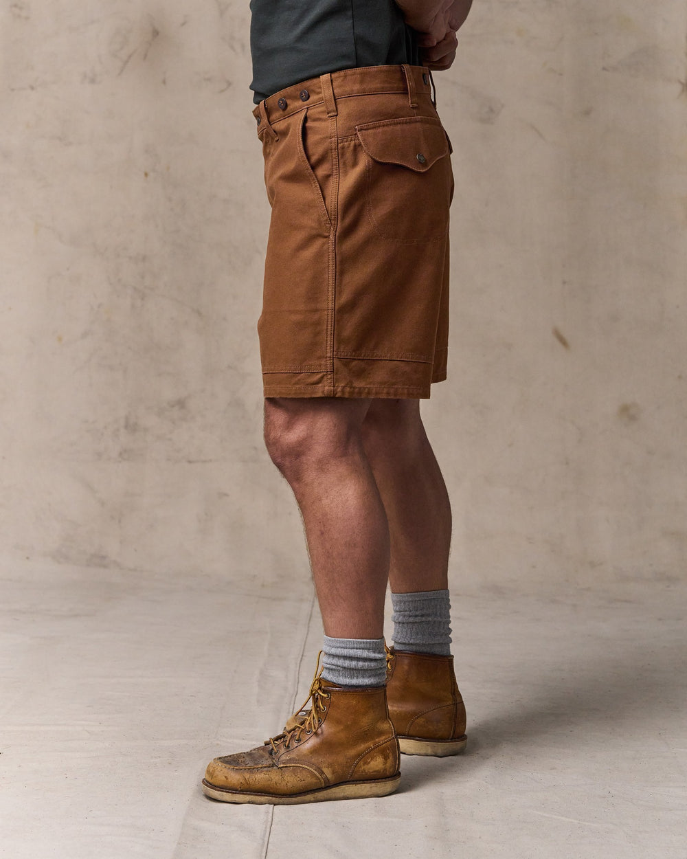image of a model wearing Filson's Dry Tin Cloth Shorts  - Whiskey