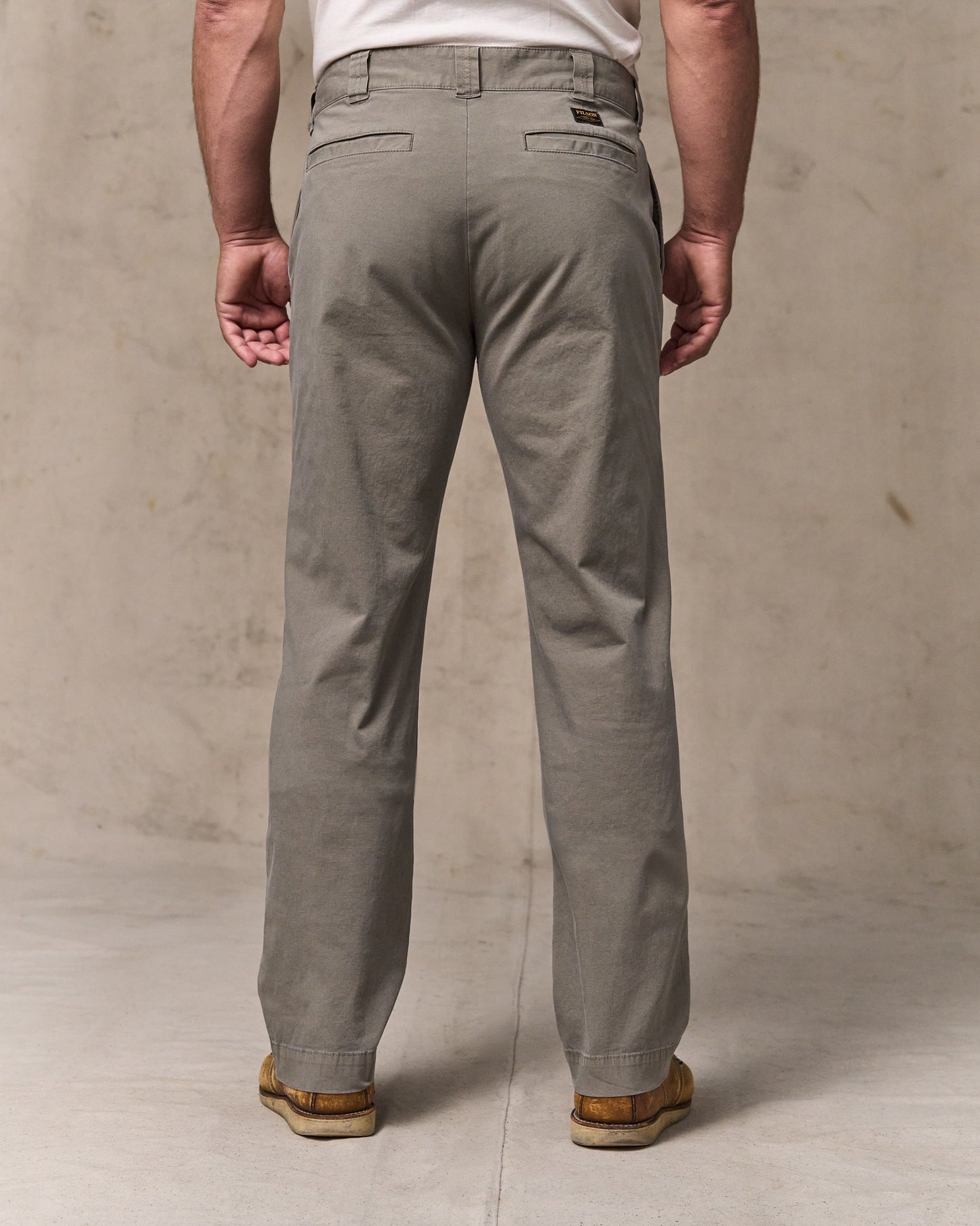 image of a model wearing Filson's Granite Mountain Flat Front Pants - Hawk Brown