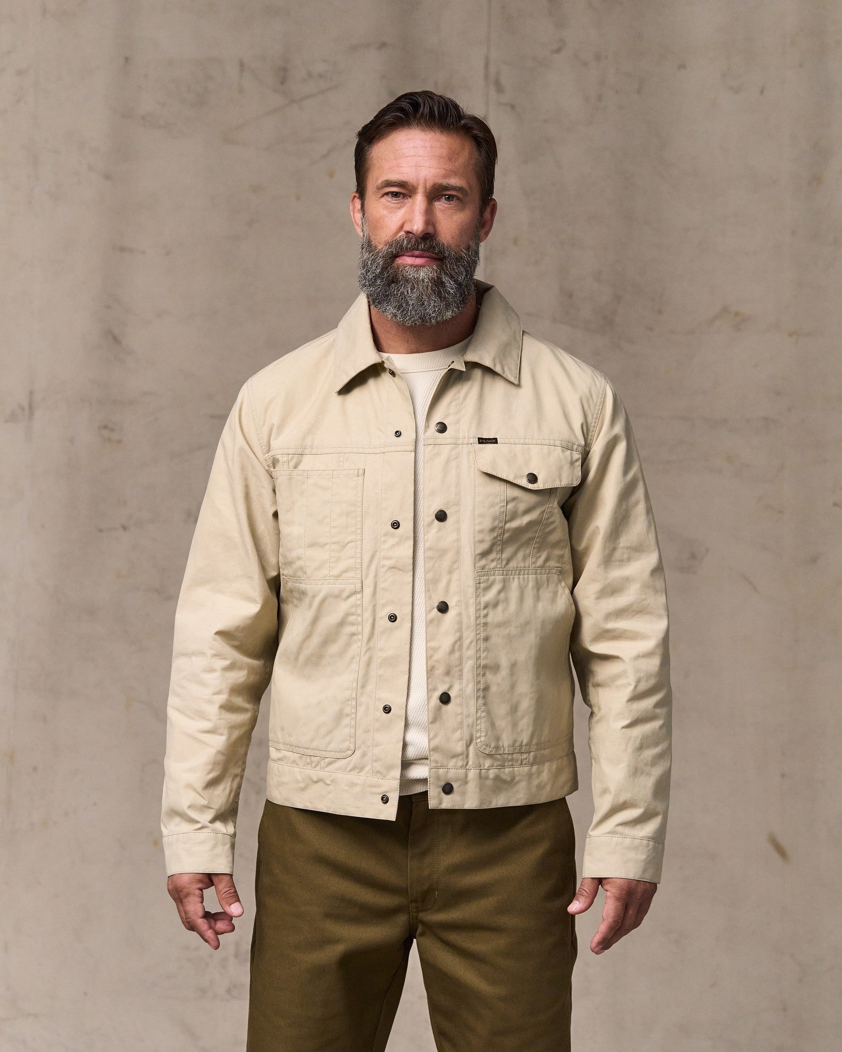 image of a model wearing Filson's Dry Wax Short Cruiser Jacket - Quail Tan