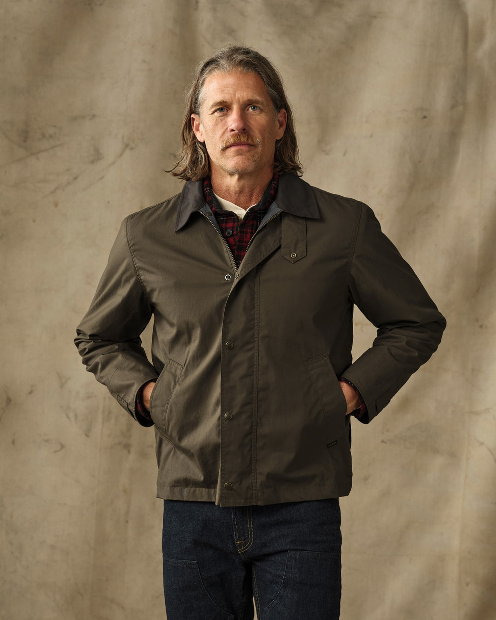 image of a model wearing Filson's Dry Wax Short Field Jacket - Burnt Olive
