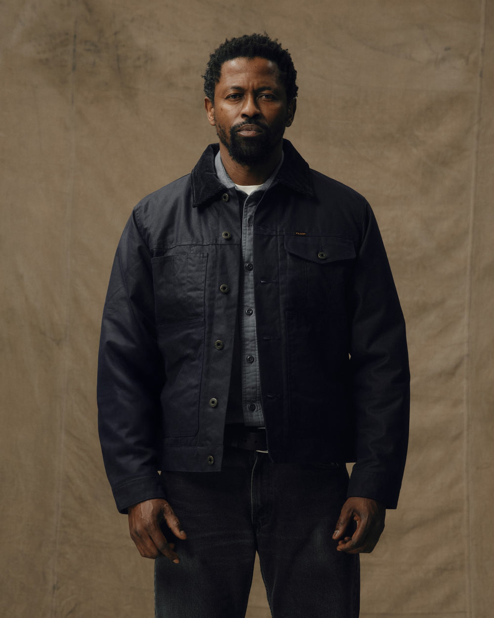 image of a model wearing Filson's Insulated Short Cruiser Jacket - Harbor Blue
