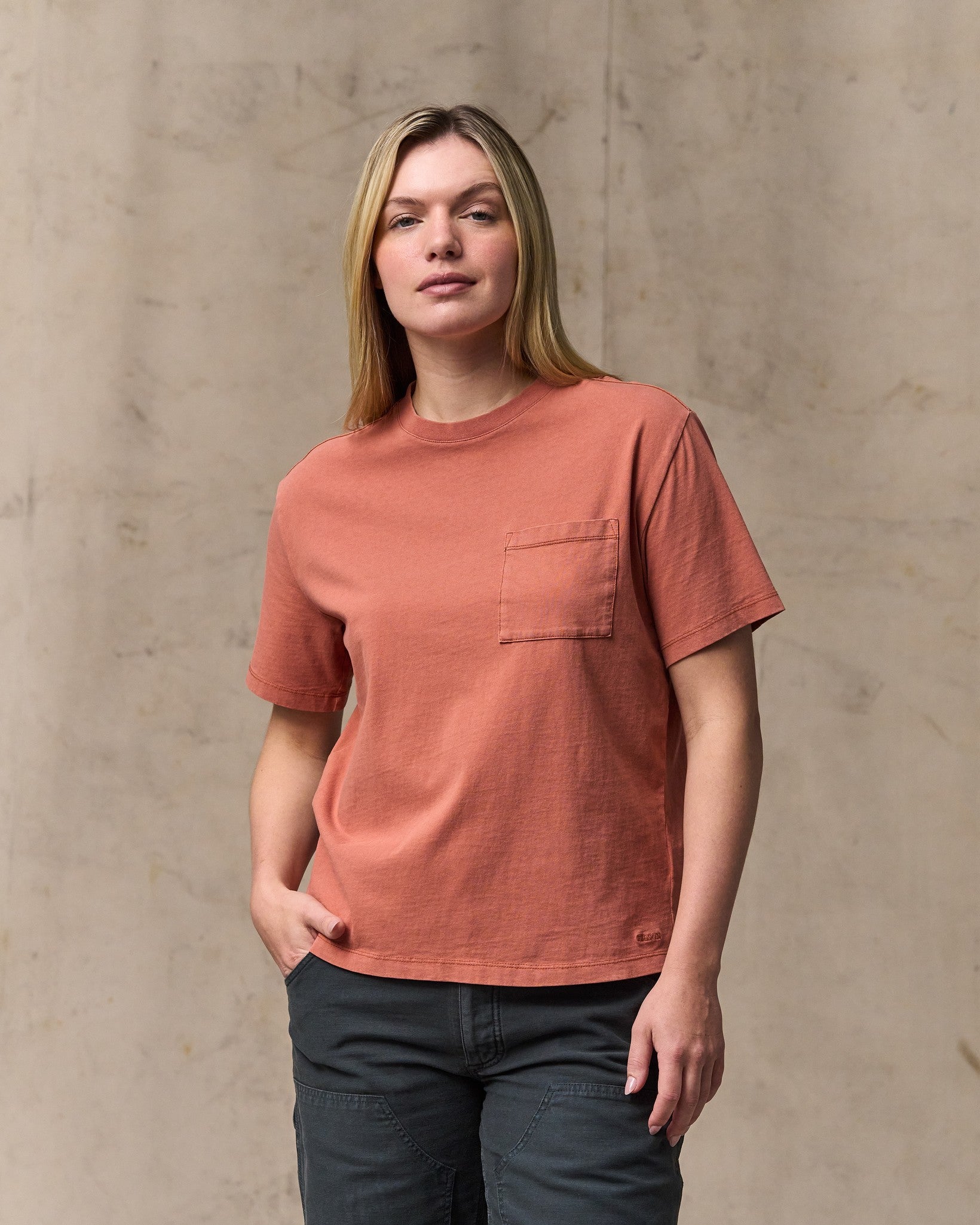 image of a model wearing Filson's Women's Short Sleeve Pocket Tee - Copper Brown