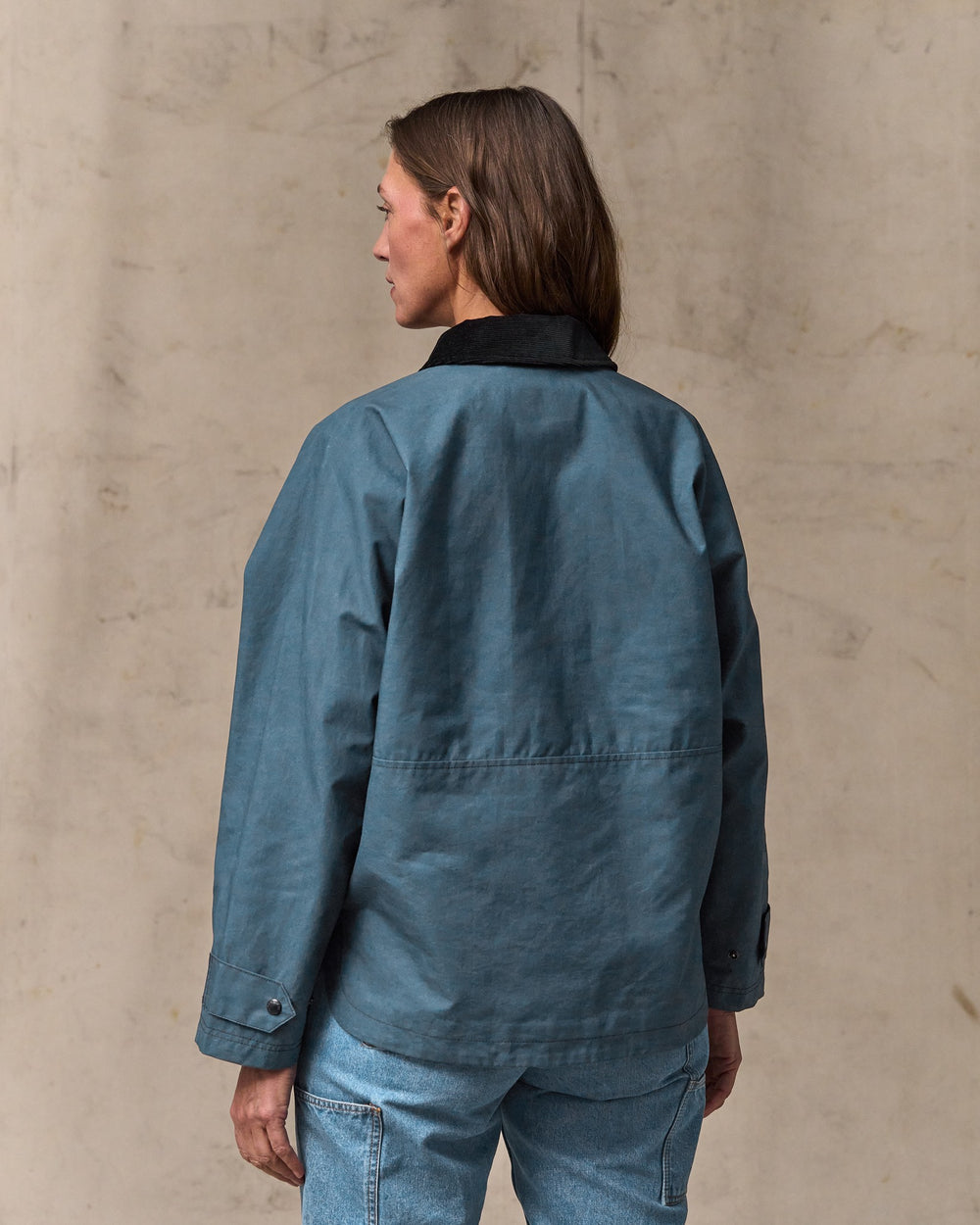 image of a model wearing Filson's Women's Harbor Front Waxed Jacket - Navy
