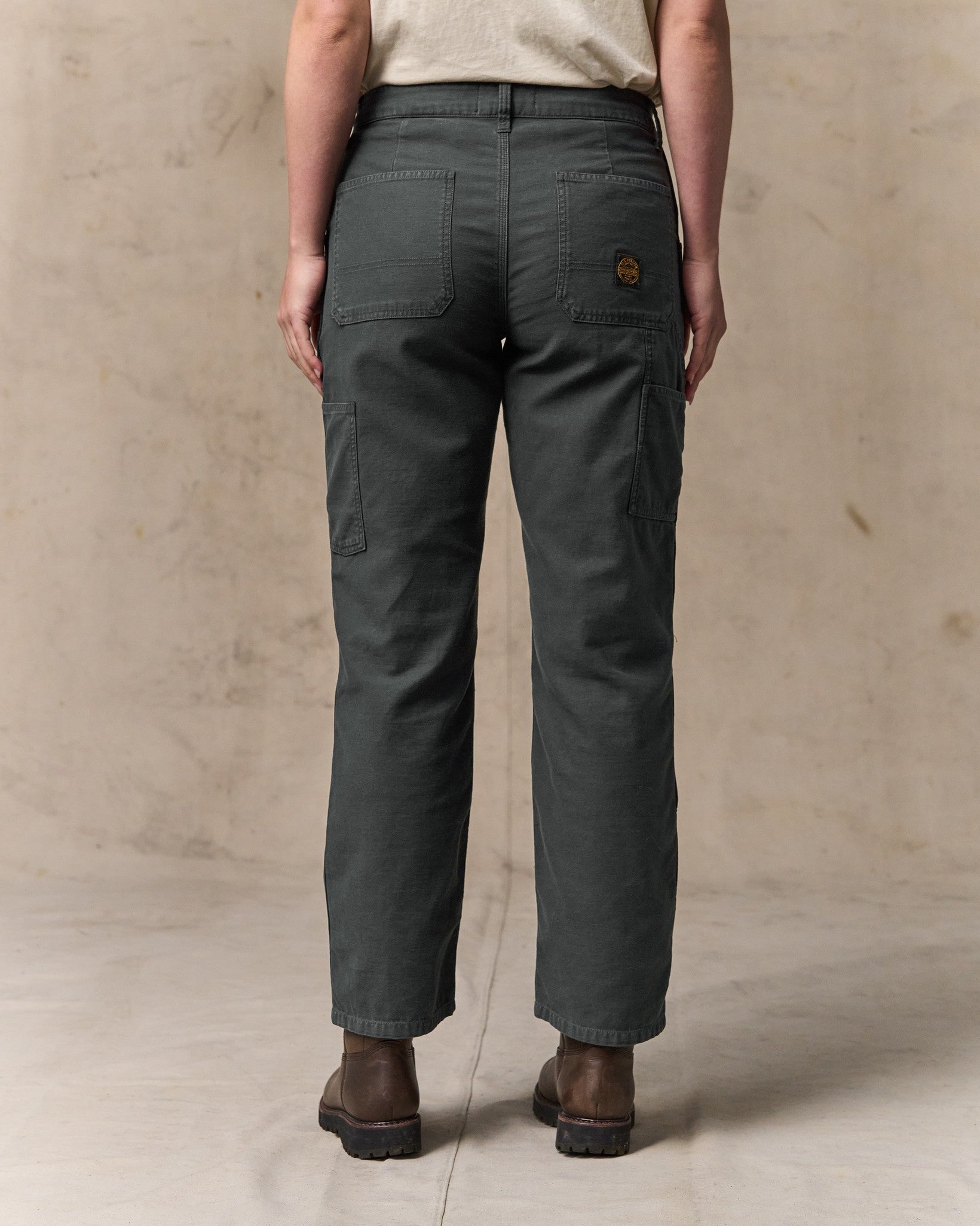 image of a model wearing Filson's Women's Reverse Sateen Double Front Pants - Faded Black