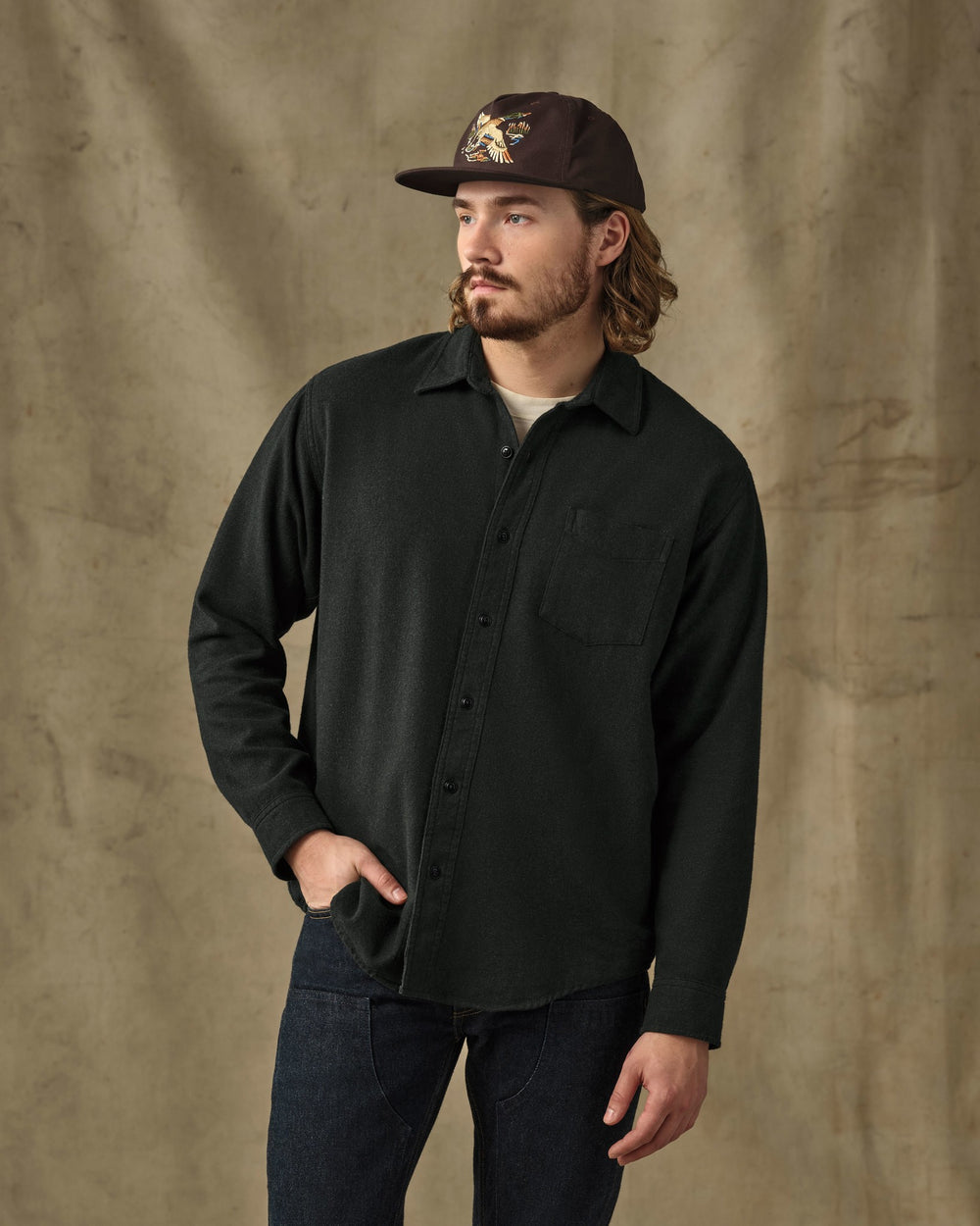 image of a model wearing Filson's Rustic Flannel Shirt - Dark Moss Heather