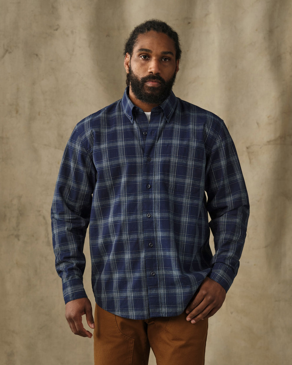image of a model wearing Filson's Chambray Button-Down Shirt - Dark Indigo Plaid