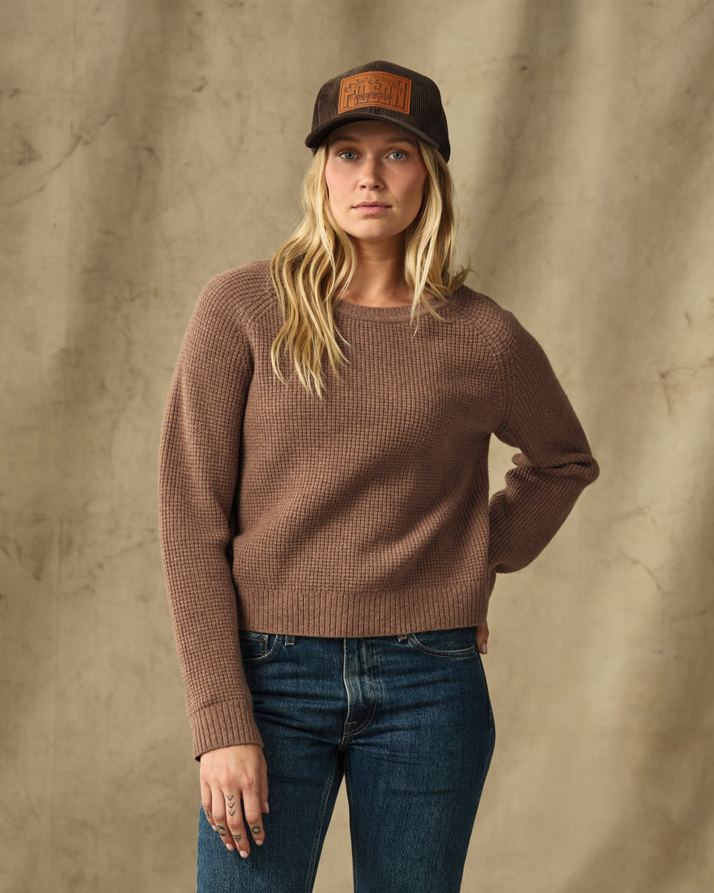 image of a model wearing Filson's Women's Waffle Knit Merino Sweater - Brown Heather