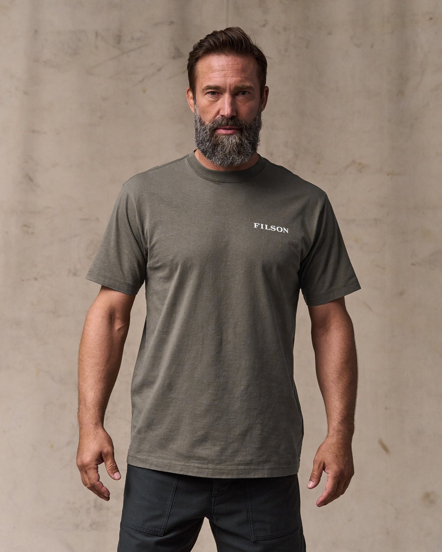 image of a model wearing Filson's Scenic Graphic T-shirt - Hawk Brown|Model is 6'1" wearing a size medium