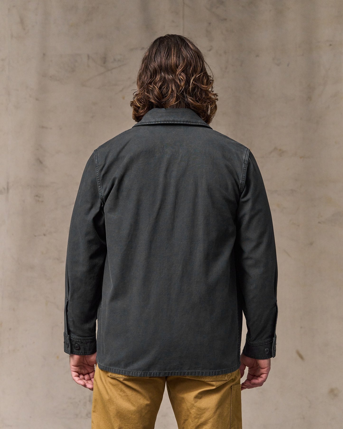 image of a model wearing Filson's Field Cruiser Jacket - Washed Faded Black