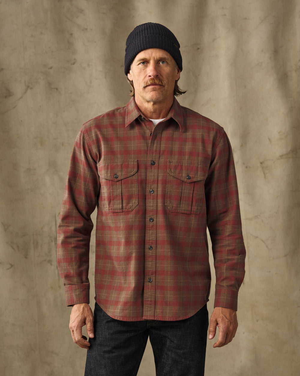image of a model wearing Filson's Alaskan Guide Shirt - Brown / Mahogany Plaid