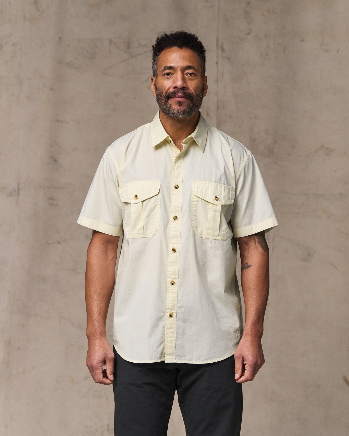 image of a model wearing Filson's Filson's Washed Short Sleeve Feather Cloth Shirt - Ivory|Model is 6'2" wearing a size medium