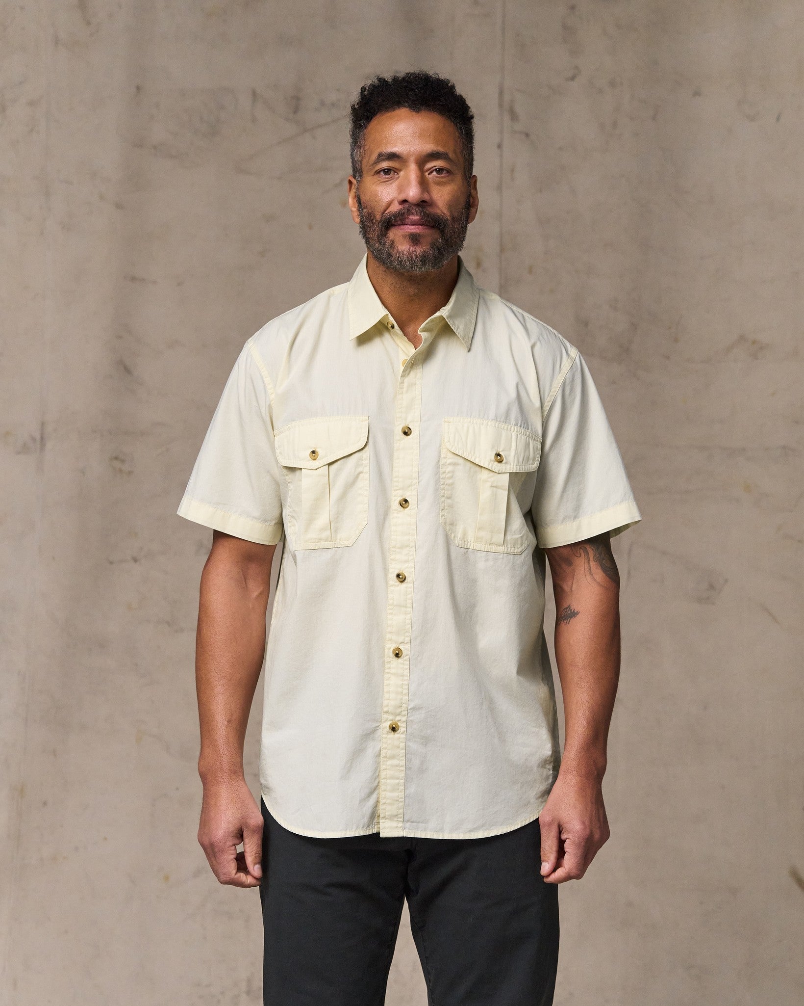 image of a model wearing Filson's Filson's Washed Short Sleeve Feather Cloth Shirt - Ivory