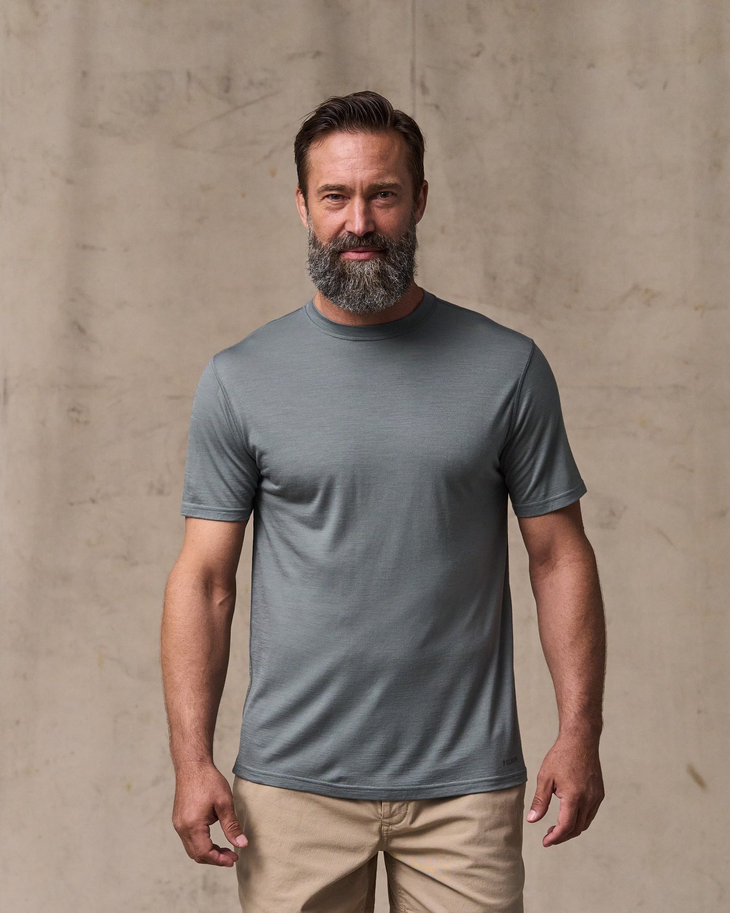 image of a model wearing Filson's Wool-blend Upf T-shirt - Sage Gray|Model is 6'1" wearing a size medium