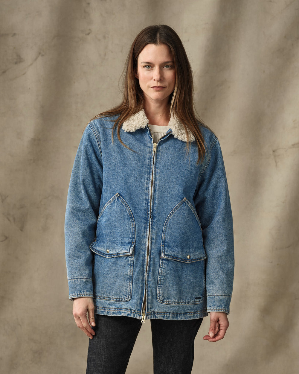 image of a model wearing Filson's Women's Insulated Denim Outfitter Coat - Vintage Indigo