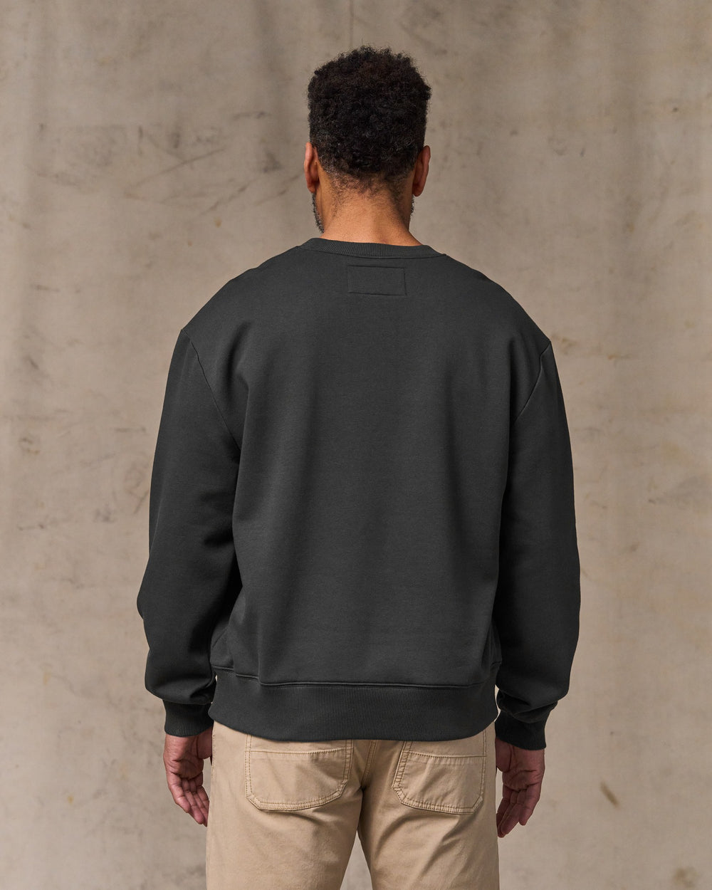image of a model wearing Filson's Northwest Crewneck Sweatshirt - Faded Black