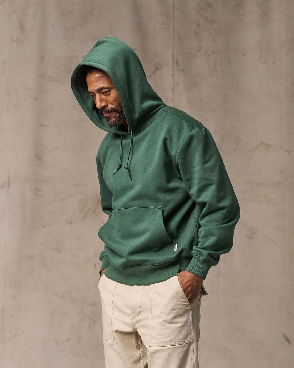 image of a model wearing Filson's Northwest Hoodie - Granite Green