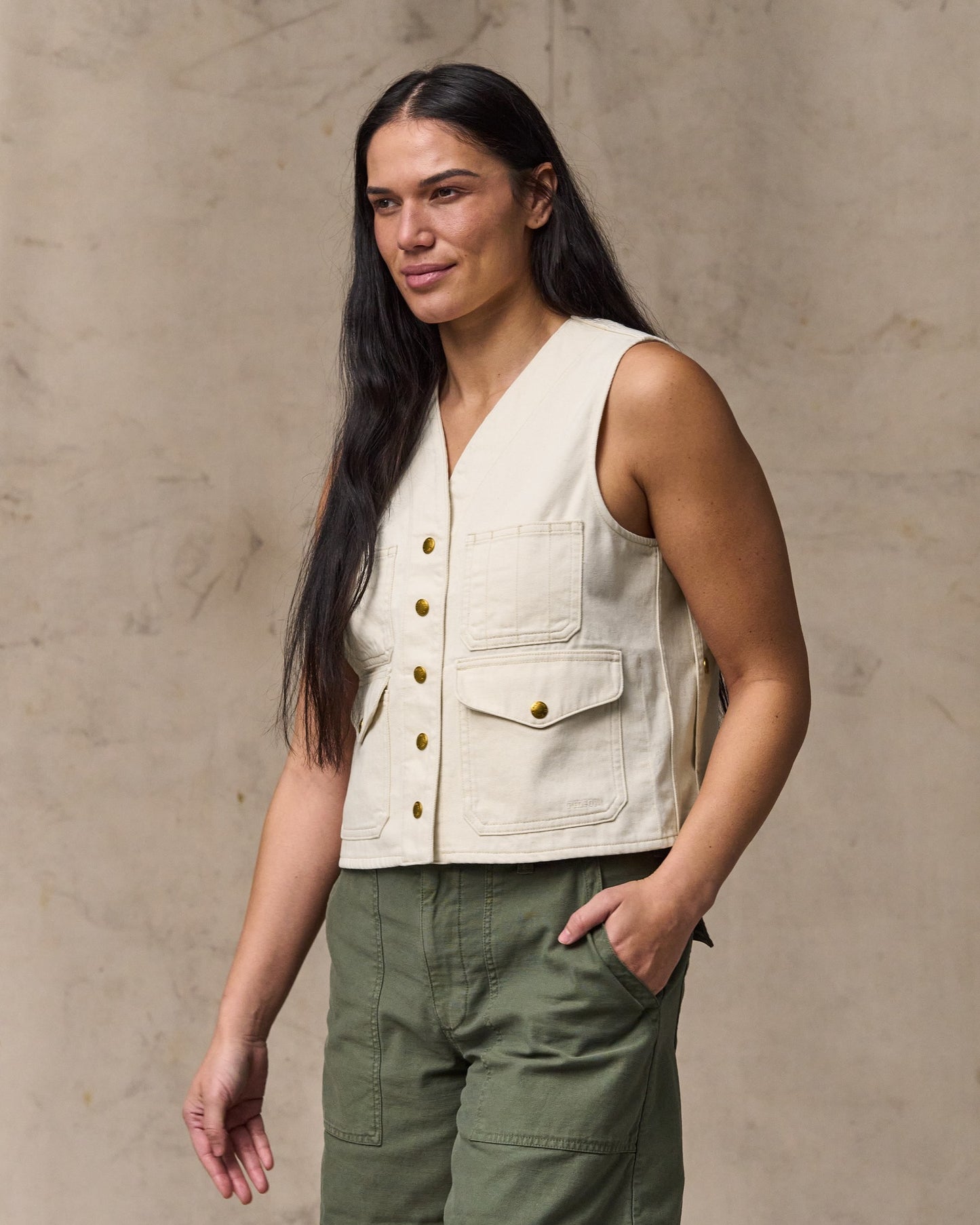 image of a model wearing Filson's Women's Archive Cruiser Vest - Natural Seed