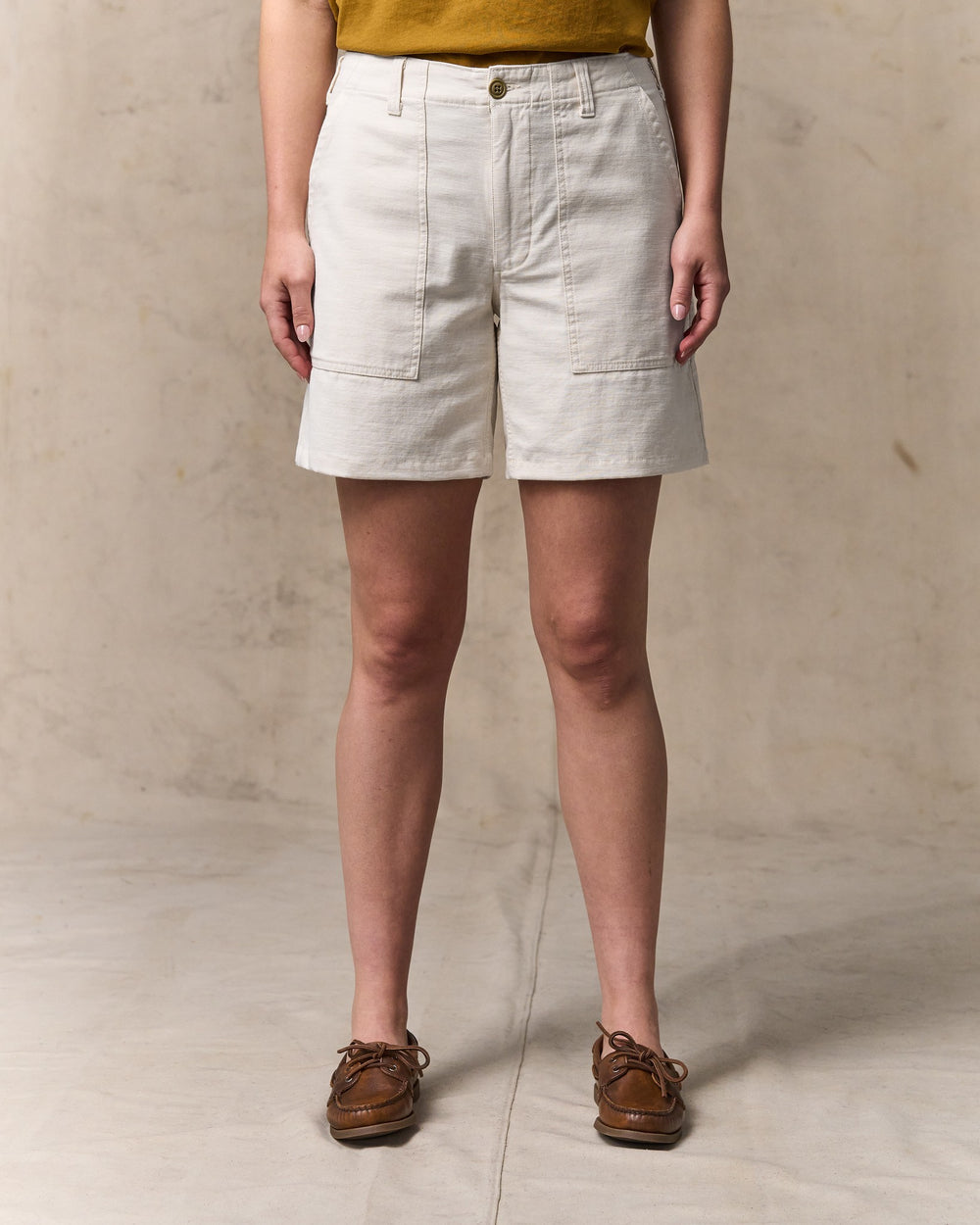 image of a model wearing Filson's Women's Reverse Sateen Supply Shorts - Natural Seed