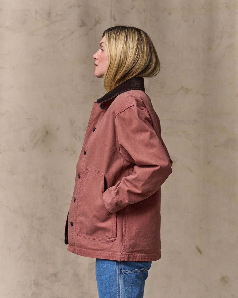 image of a model wearing Filson's Women's Canvas Barn Coat - Mahogany