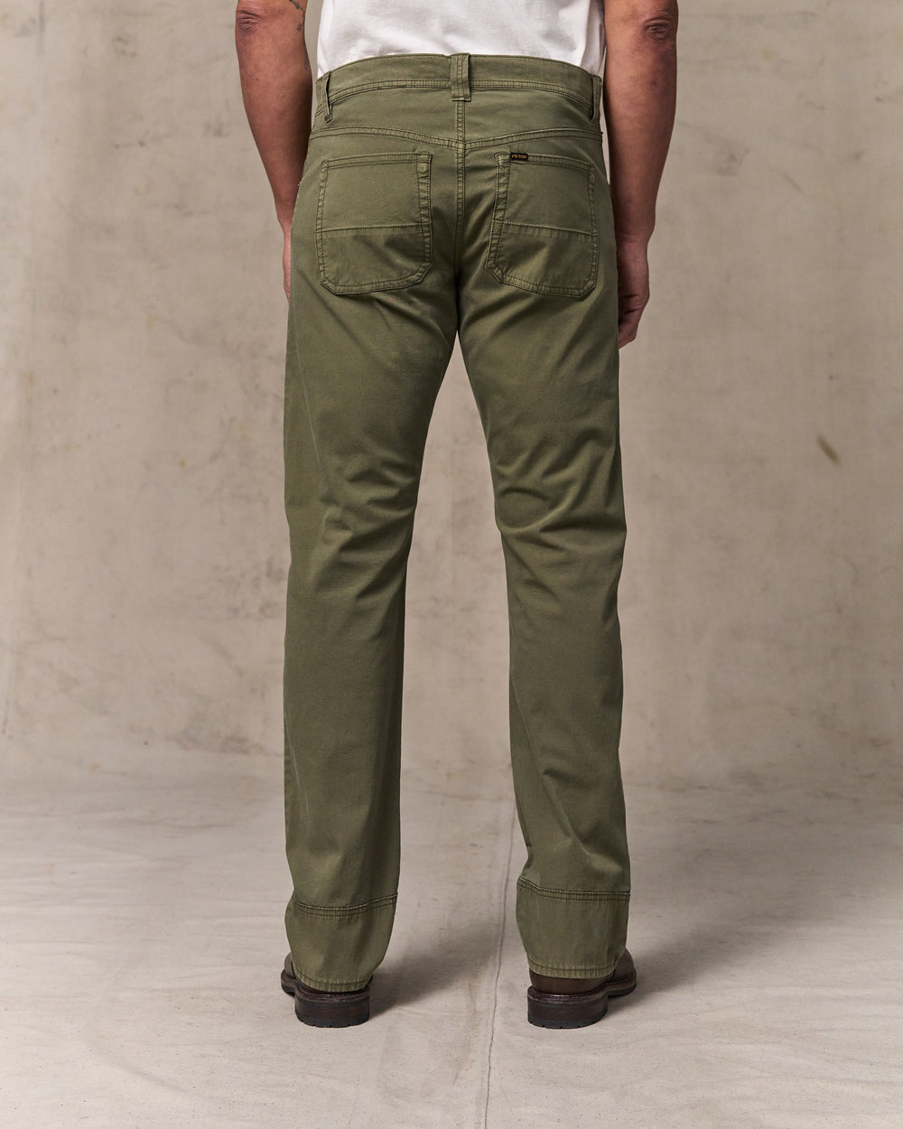 image of a model wearing Filson's Granite Mountain 5-pocket Pants - Burnt Olive