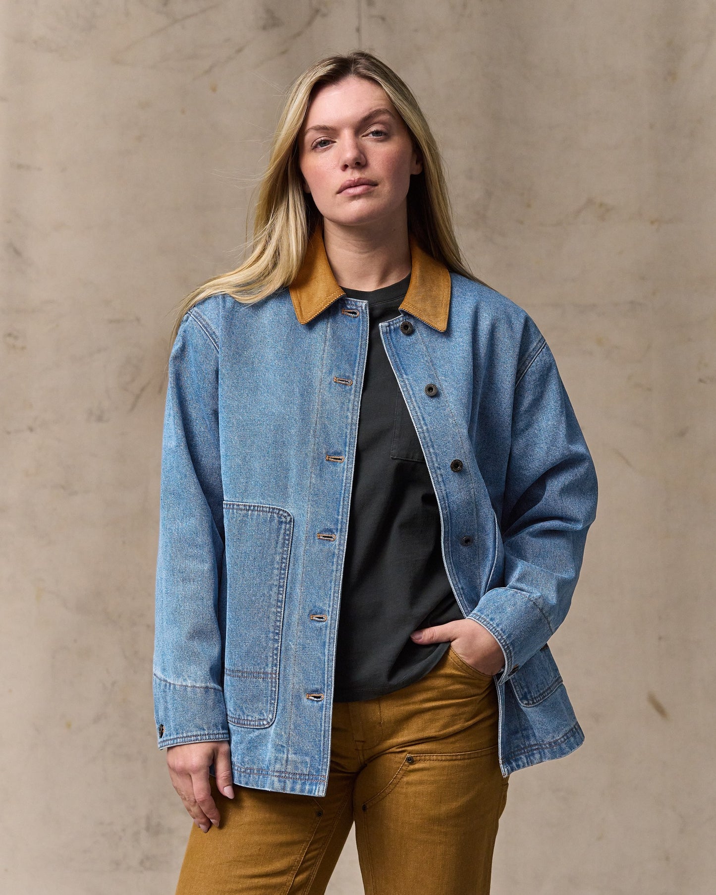 image of a model wearing Filson's Women's 11-oz. Denim Barn Coat - Light Indigo|Model is 5'10" wearing a size medium|Model is 5'10" wearing a size medium