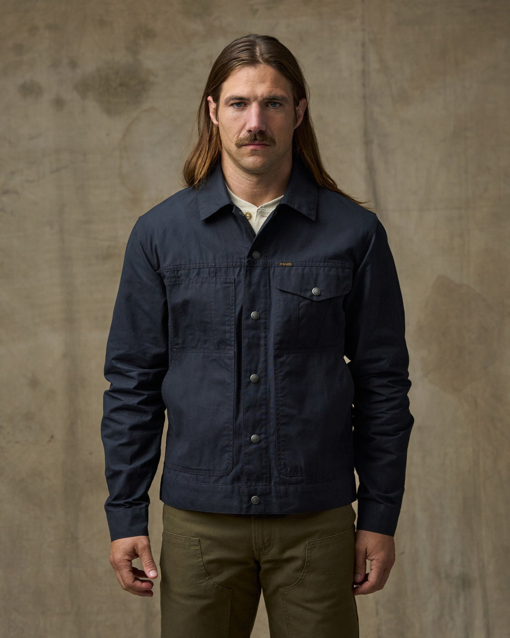 image of a model wearing Filson's Dry Wax Short Cruiser Jacket - Navy