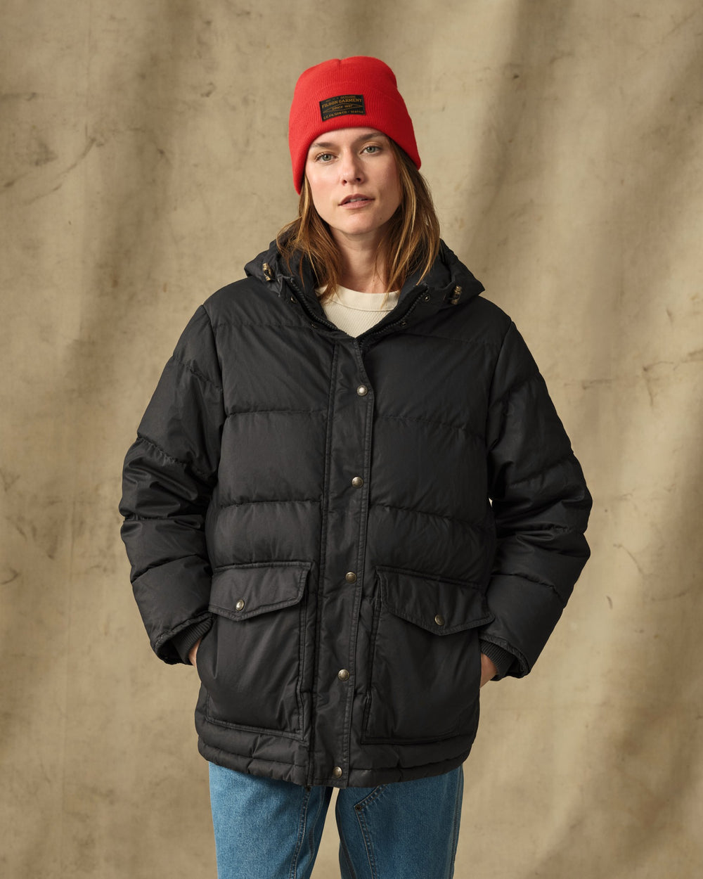 image of a model wearing Filson's Women's Heritage Cotton Down Parka - Black