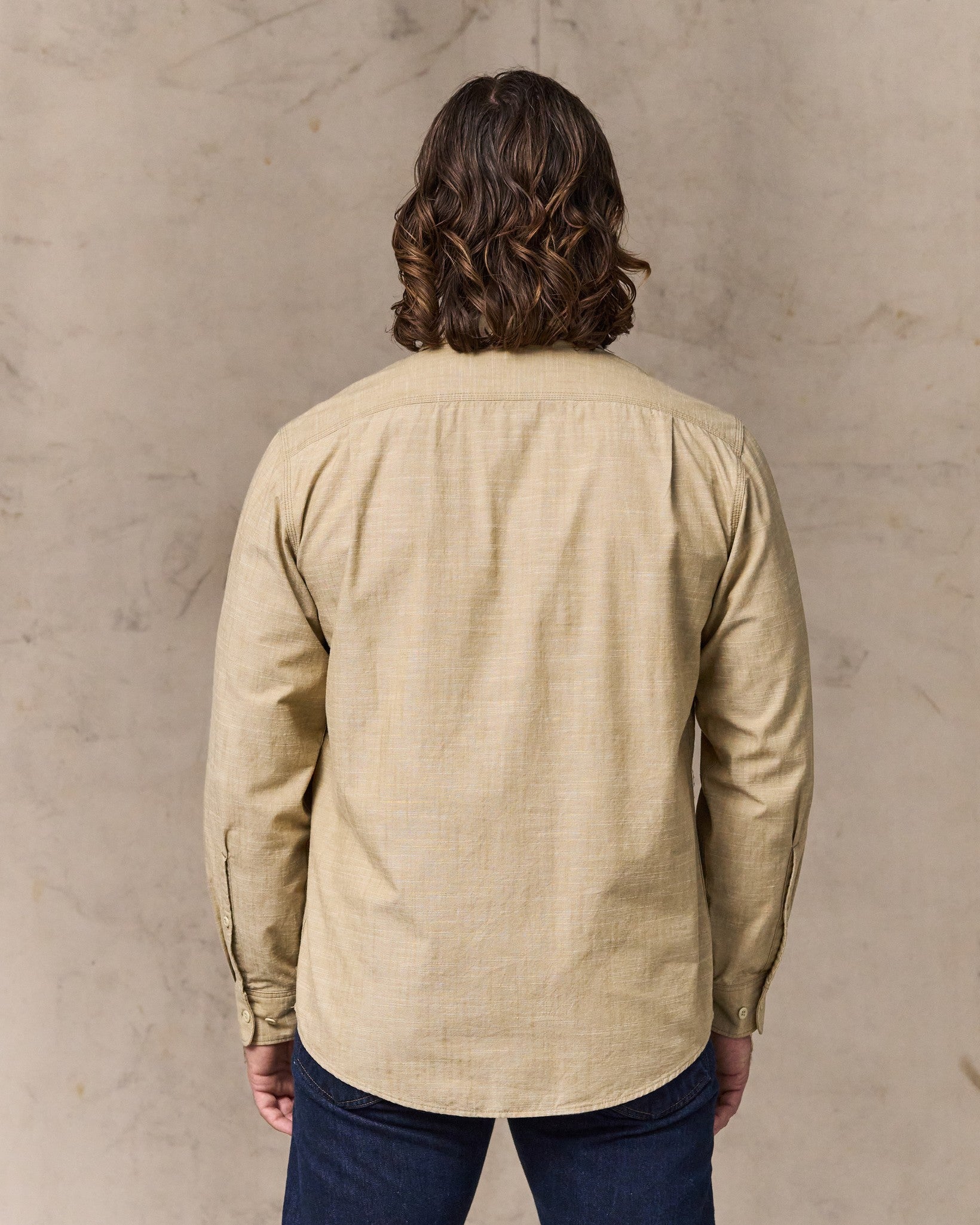 image of a model wearing Filson's Chambray Cpo Shirt - Tan