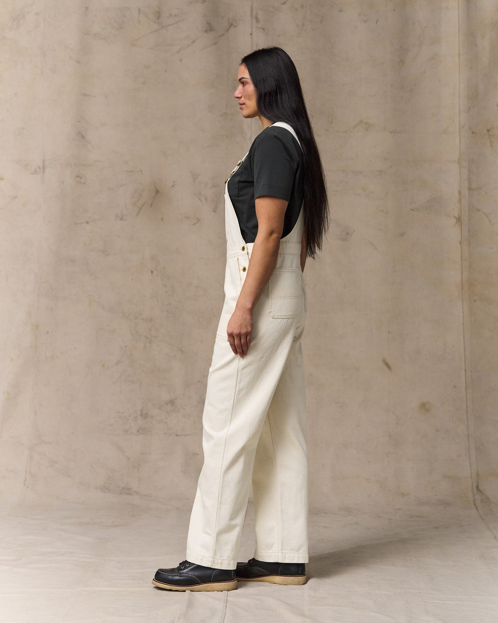 image of a model wearing Filson's Women's Denim Overalls - Natural Seed