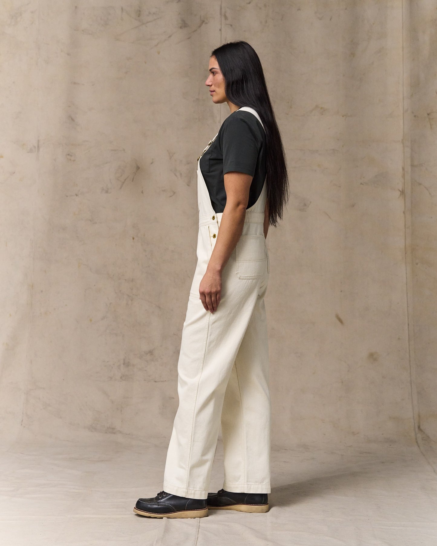 image of a model wearing Filson's Women's Denim Overalls - Natural Seed