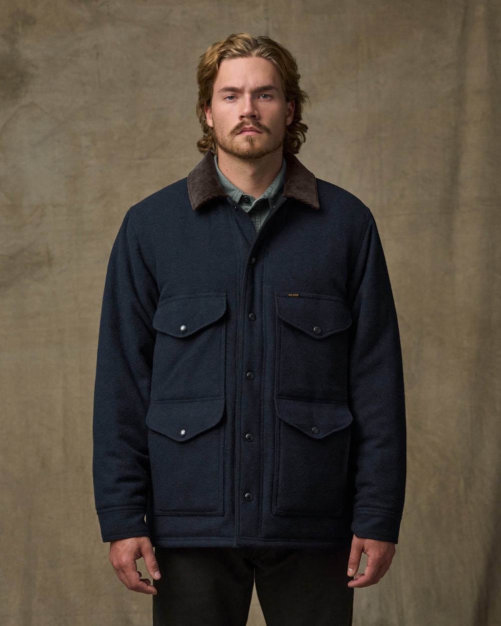 image of a model wearing Filson's Spokane Insulated Cruiser Jacket - Navy