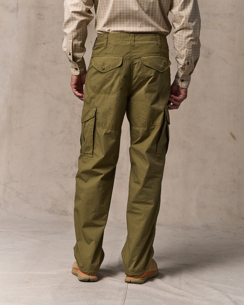 image of a model wearing Filson's Tropical Poplin Cargo Pants - Military Olive