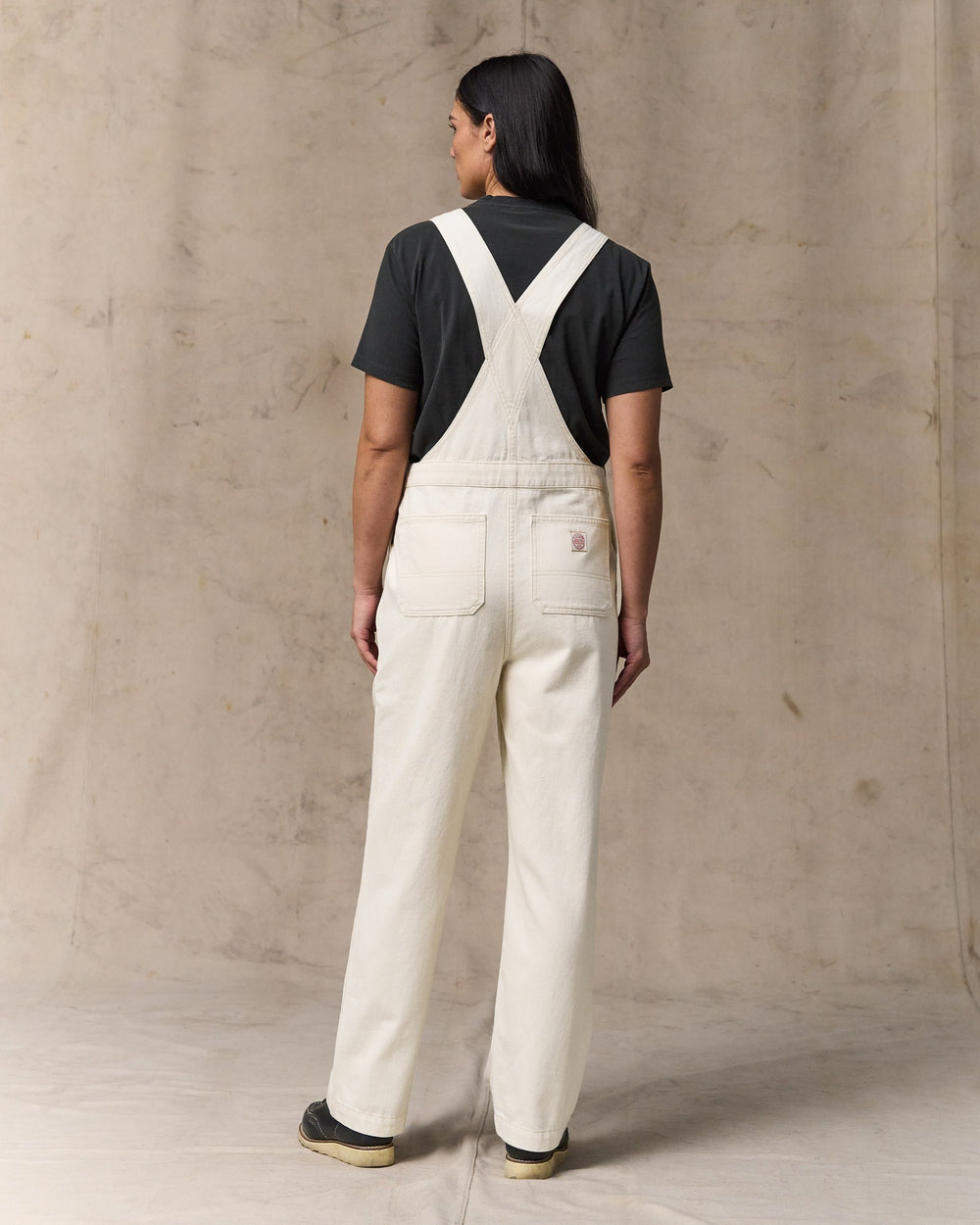 image of a model wearing Filson's Women's Denim Overalls - Natural Seed
