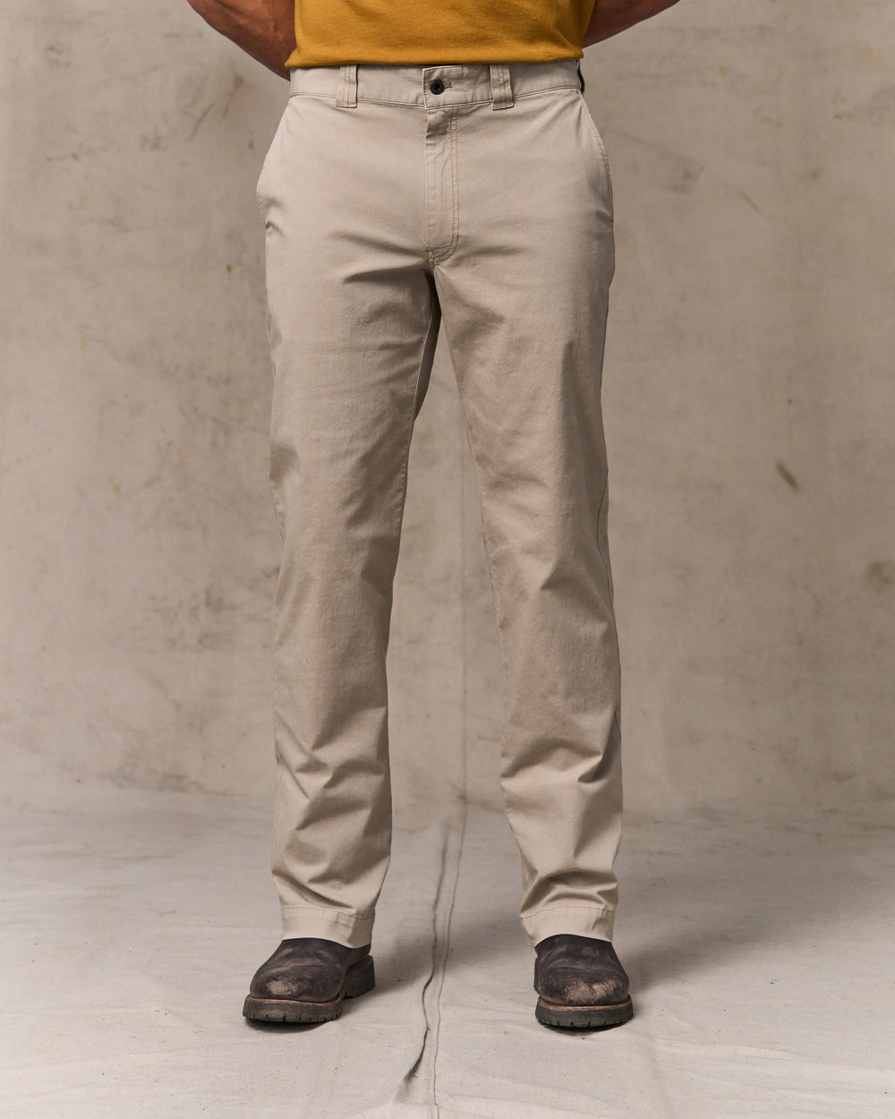 image of a model wearing Filson's Granite Mountain Flat Front Pants - Buck Tan