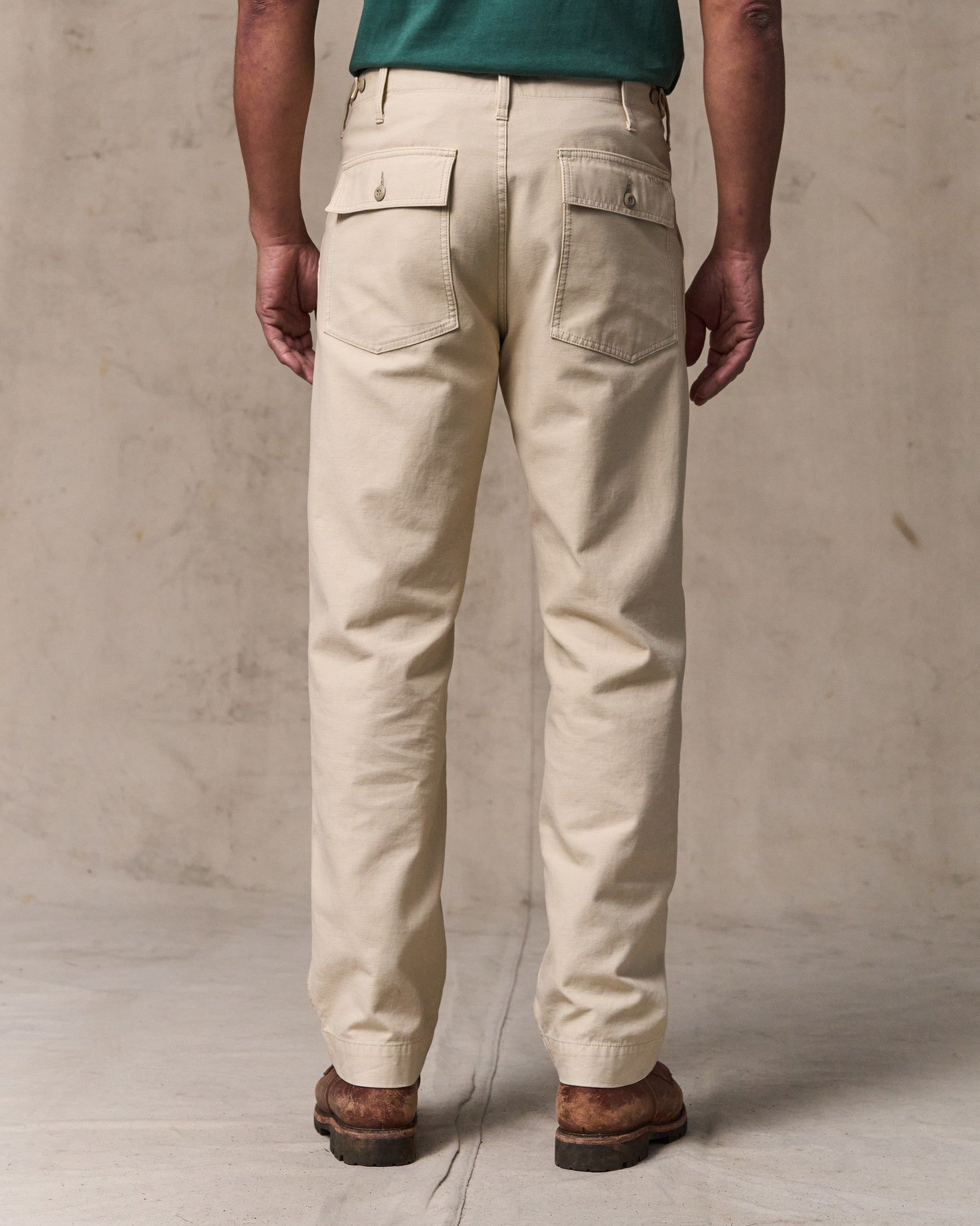 image of a model wearing Filson's Field Supply Pants - Washed Oatmeal