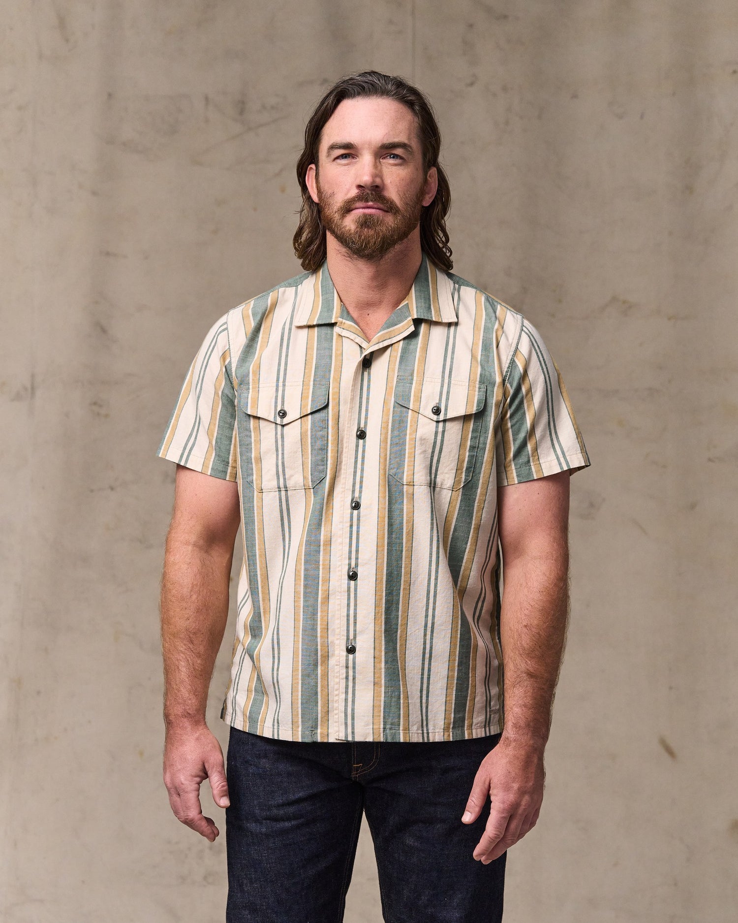 image of a model wearing Filson's Chambray Camp Shirt - Natural / Khaki|Model is 6'1" wearing a size medium