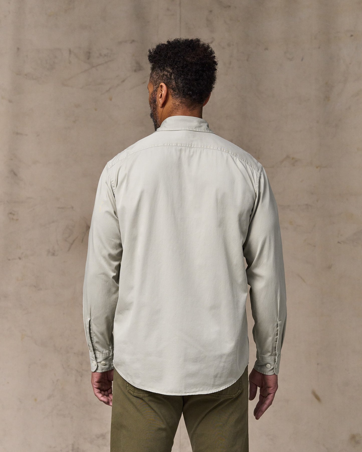 image of a model wearing Filson's 4.5-oz. Twill Shirt - Gray Sky