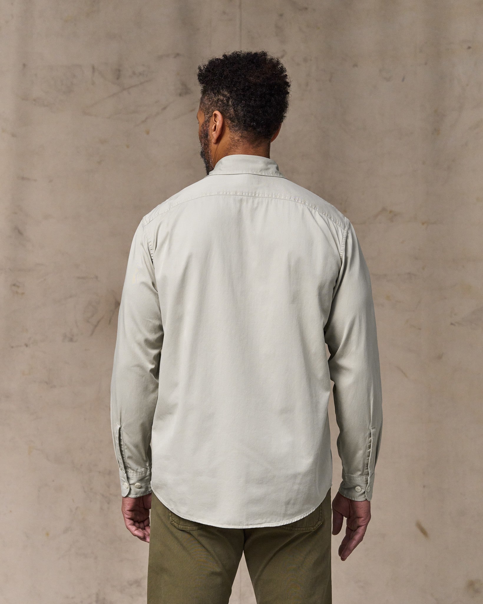 image of a model wearing Filson's 4.5-oz. Twill Shirt - Gray Sky