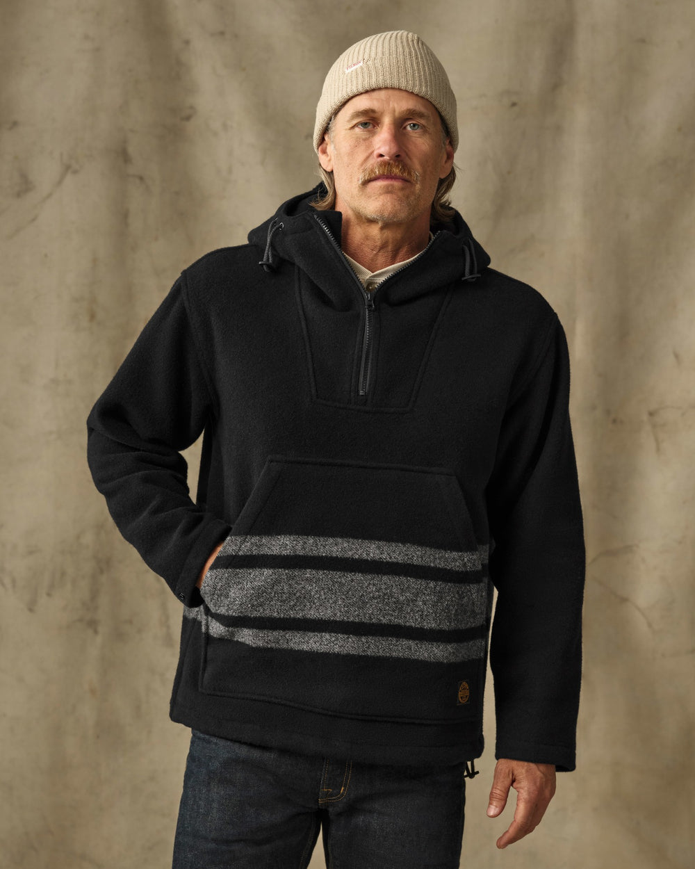 image of a model wearing Filson's Mackinaw Wool Anorak - Black / Gray Stripe