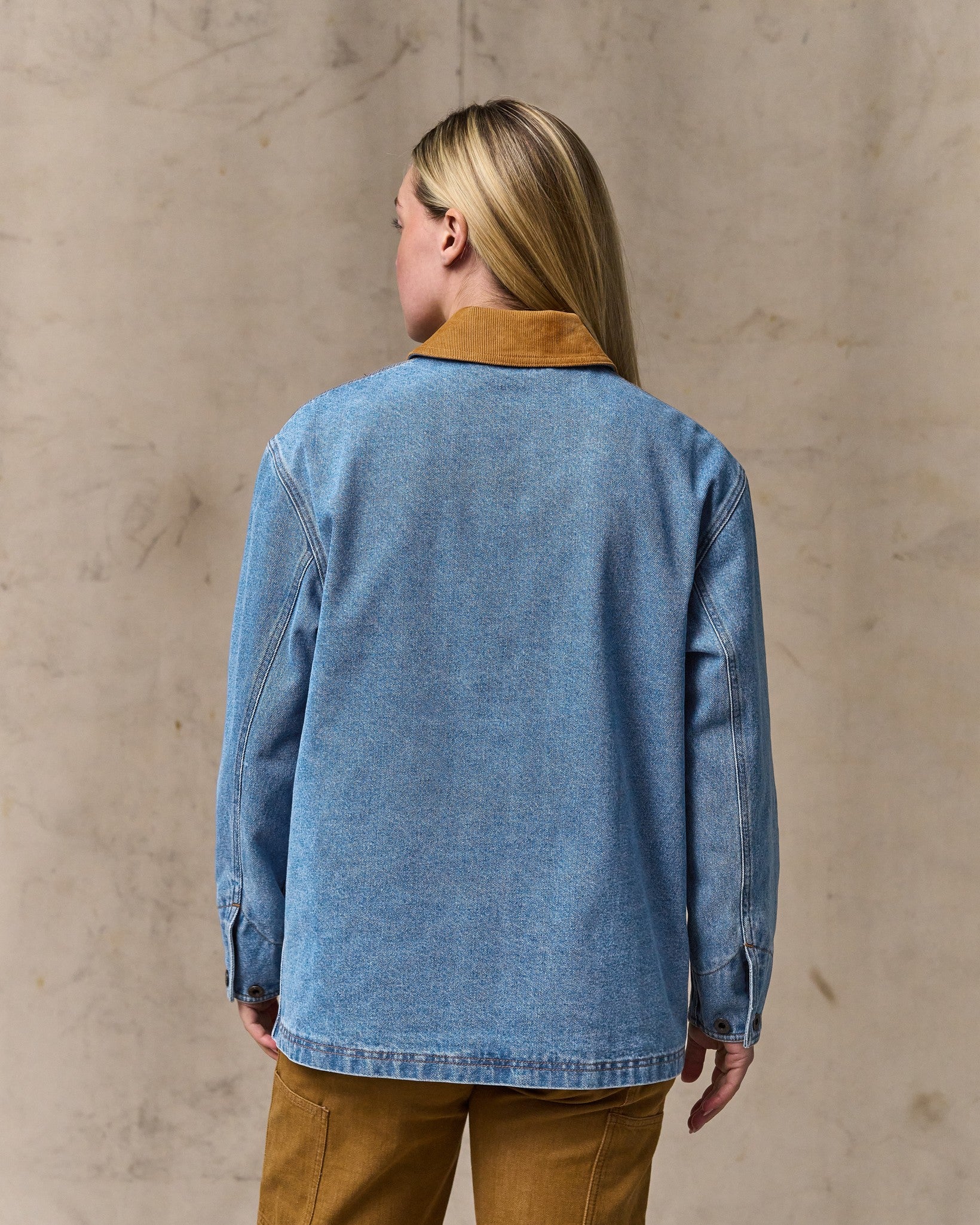 image of a model wearing Filson's Women's 11-oz. Denim Barn Coat - Light Indigo