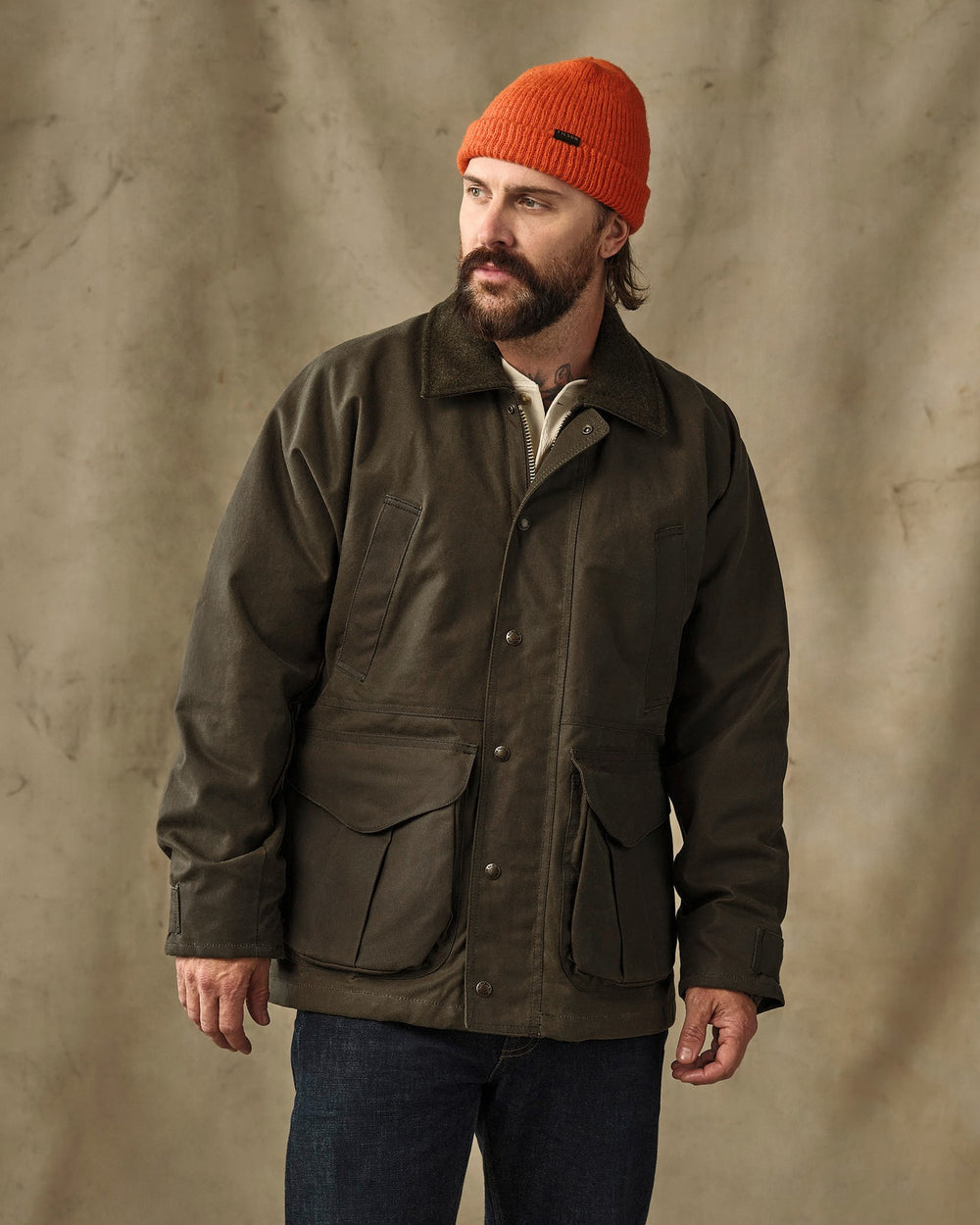 image of a model wearing Filson's Lined Tin Cloth Field Jacket - Otter Green