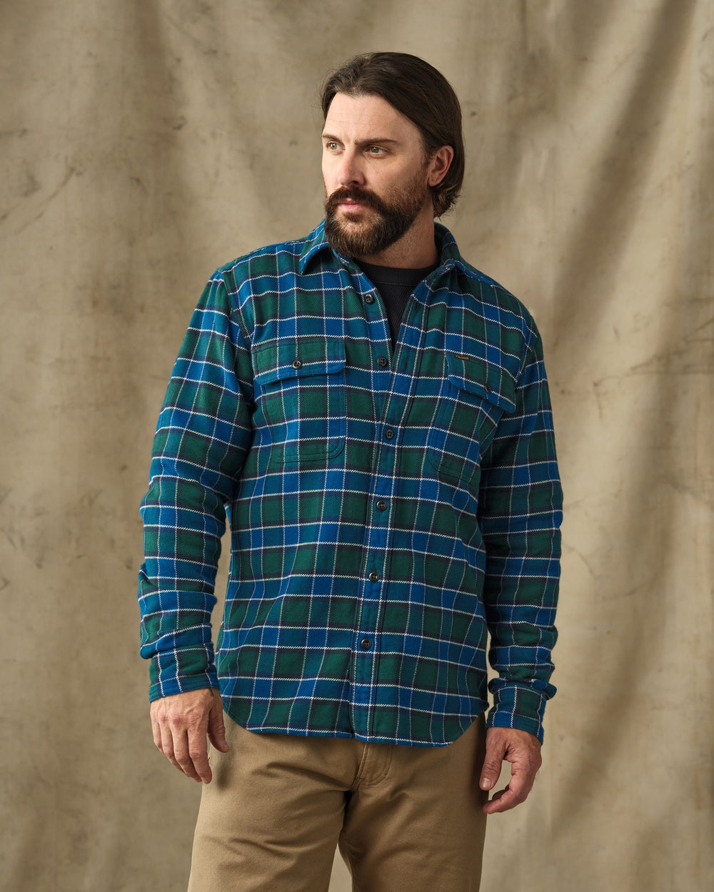 image of a model wearing Filson's Vintage Flannel Work Shirt - Blue / Green Plaid
