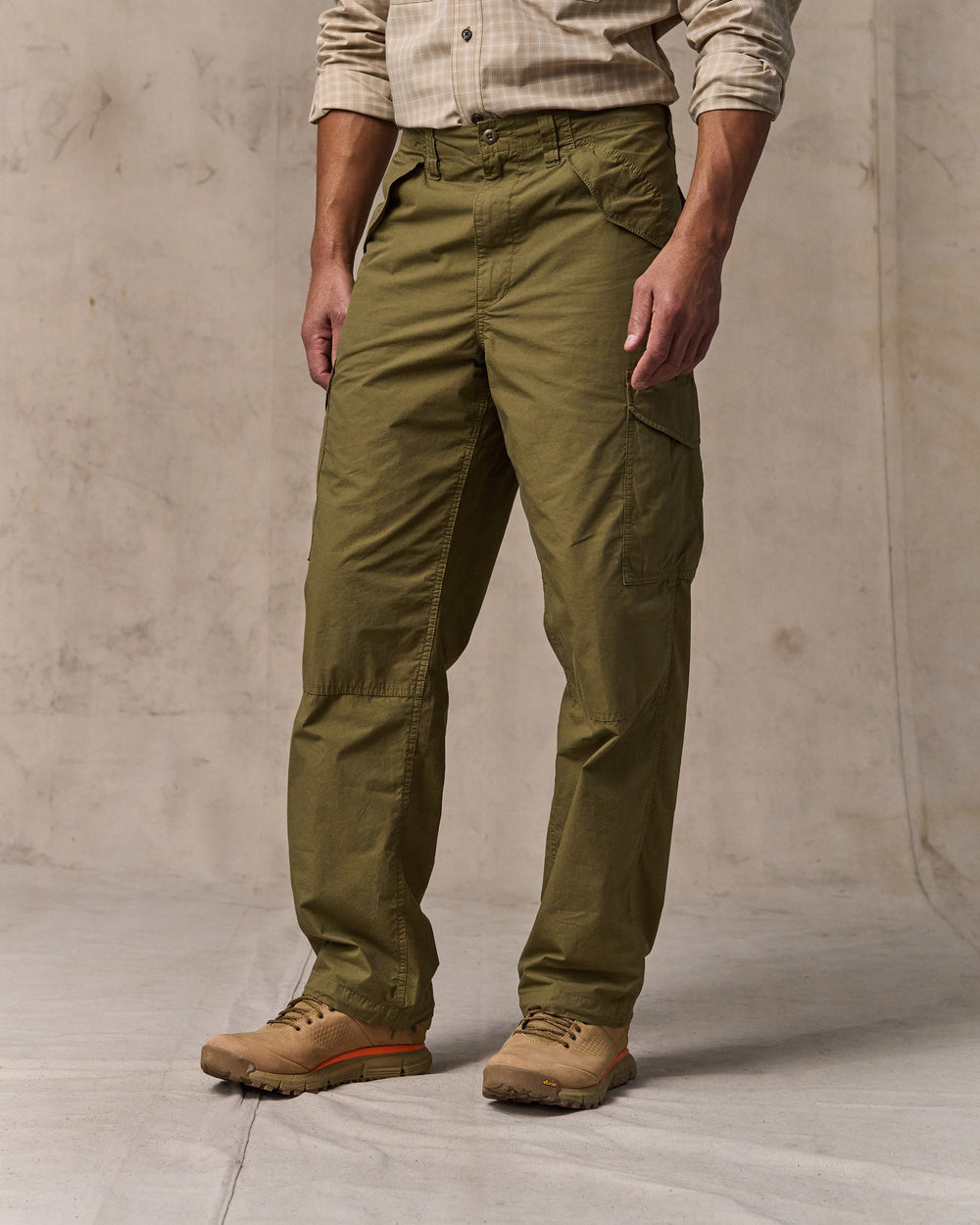 image of a model wearing Filson's Tropical Poplin Cargo Pants - Military Olive