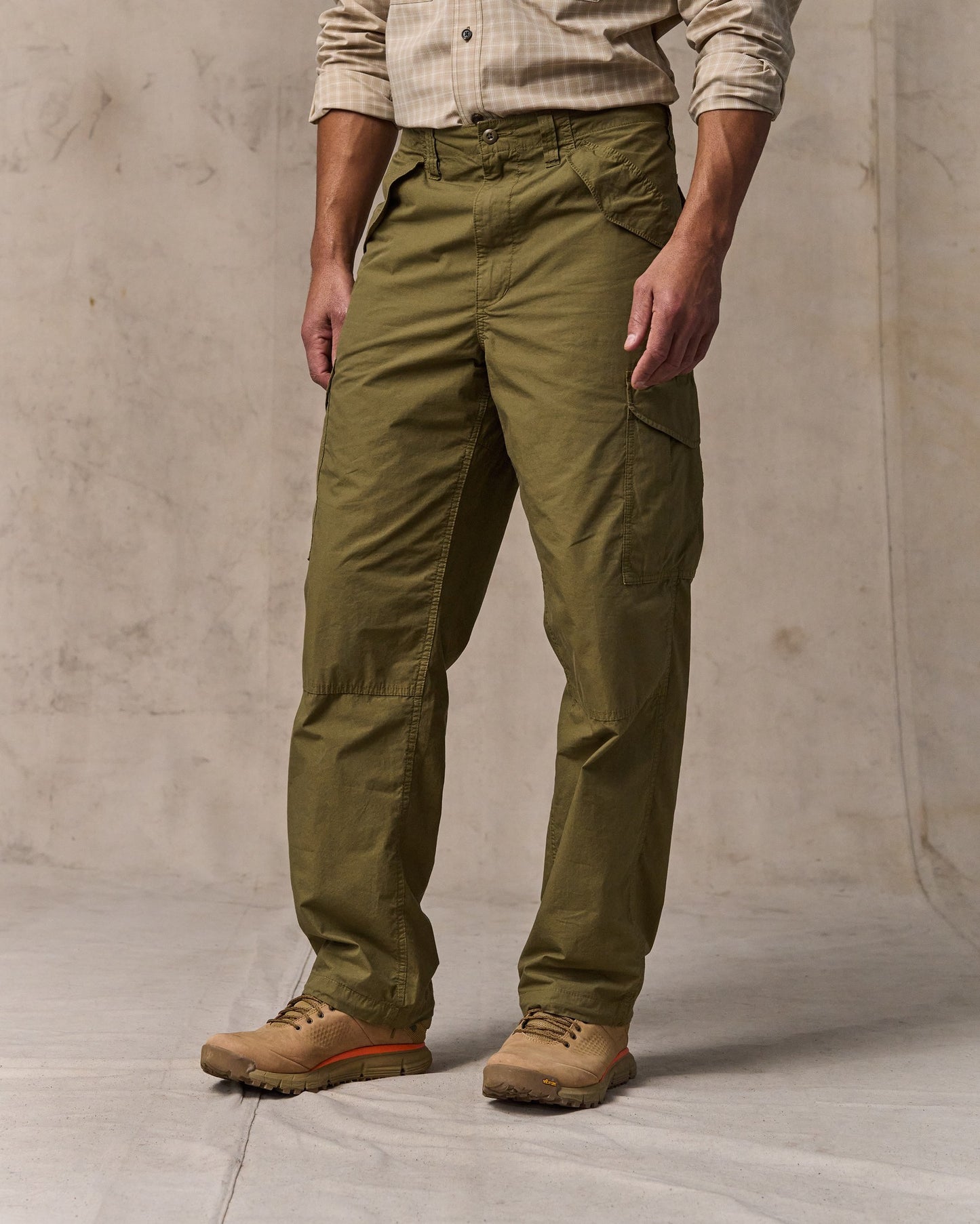 image of a model wearing Filson's Tropical Poplin Cargo Pants - Military Olive