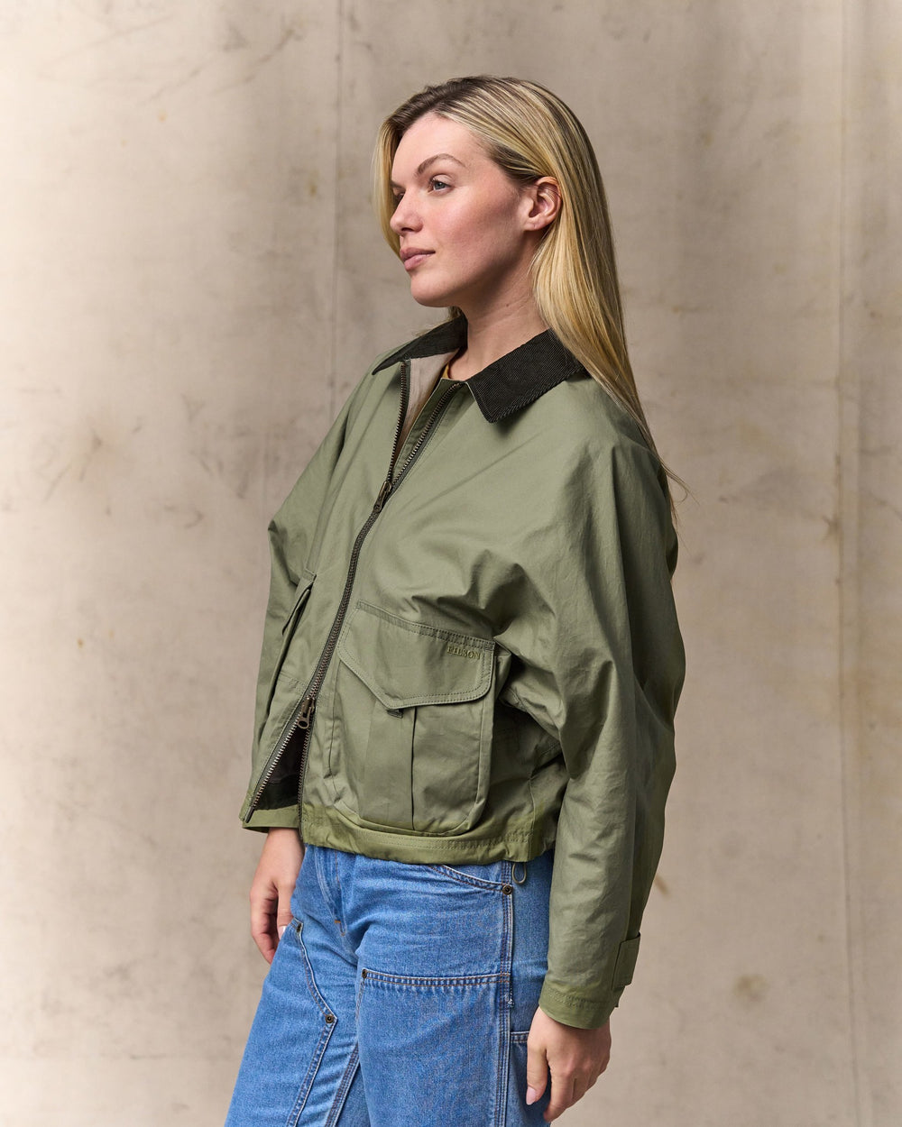 image of a model wearing Filson's Women's Dry Wax Short Work Jacket - Slate Olive
