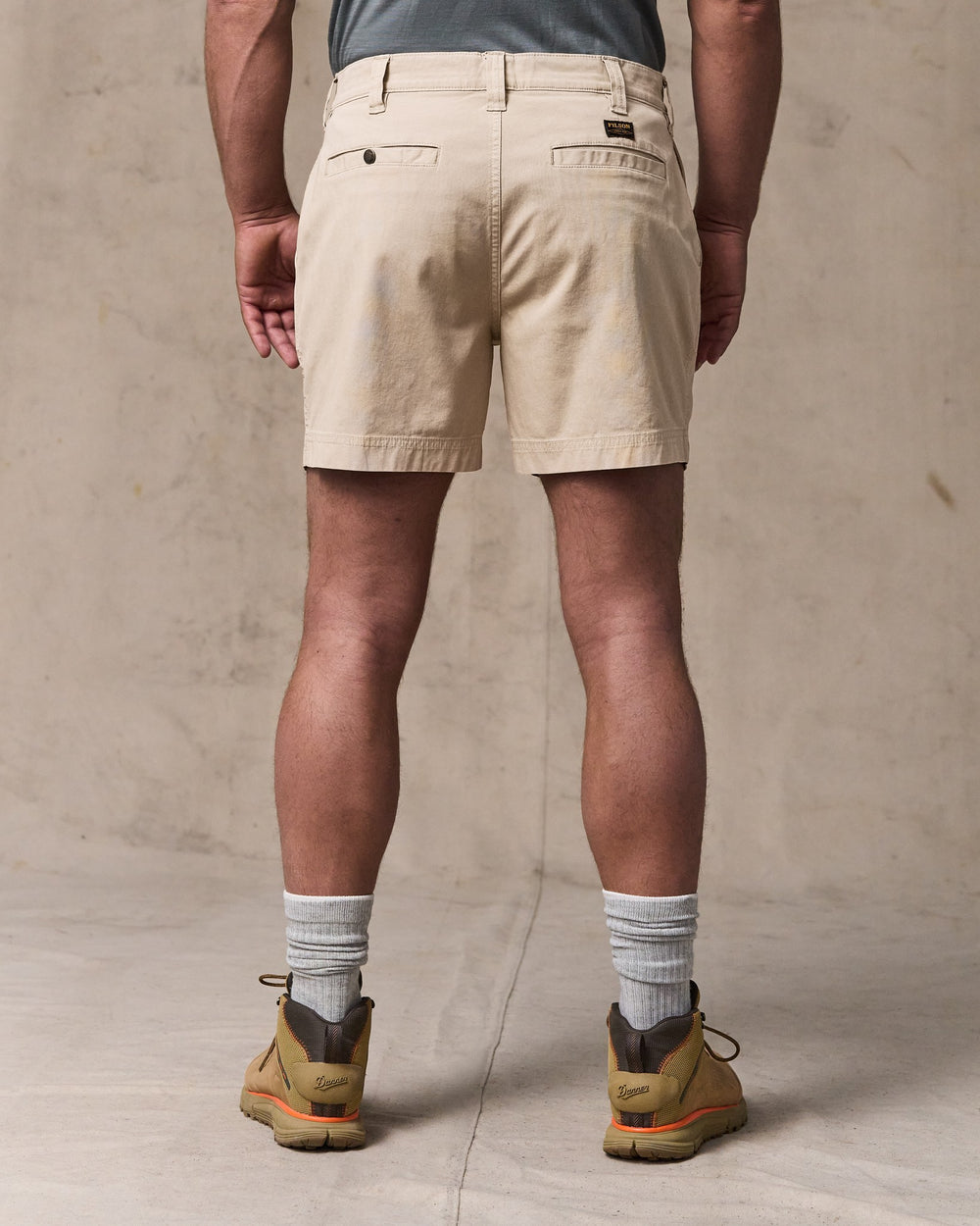 image of a model wearing Filson's Granite Mountain 6" Shorts - Buck Tan
