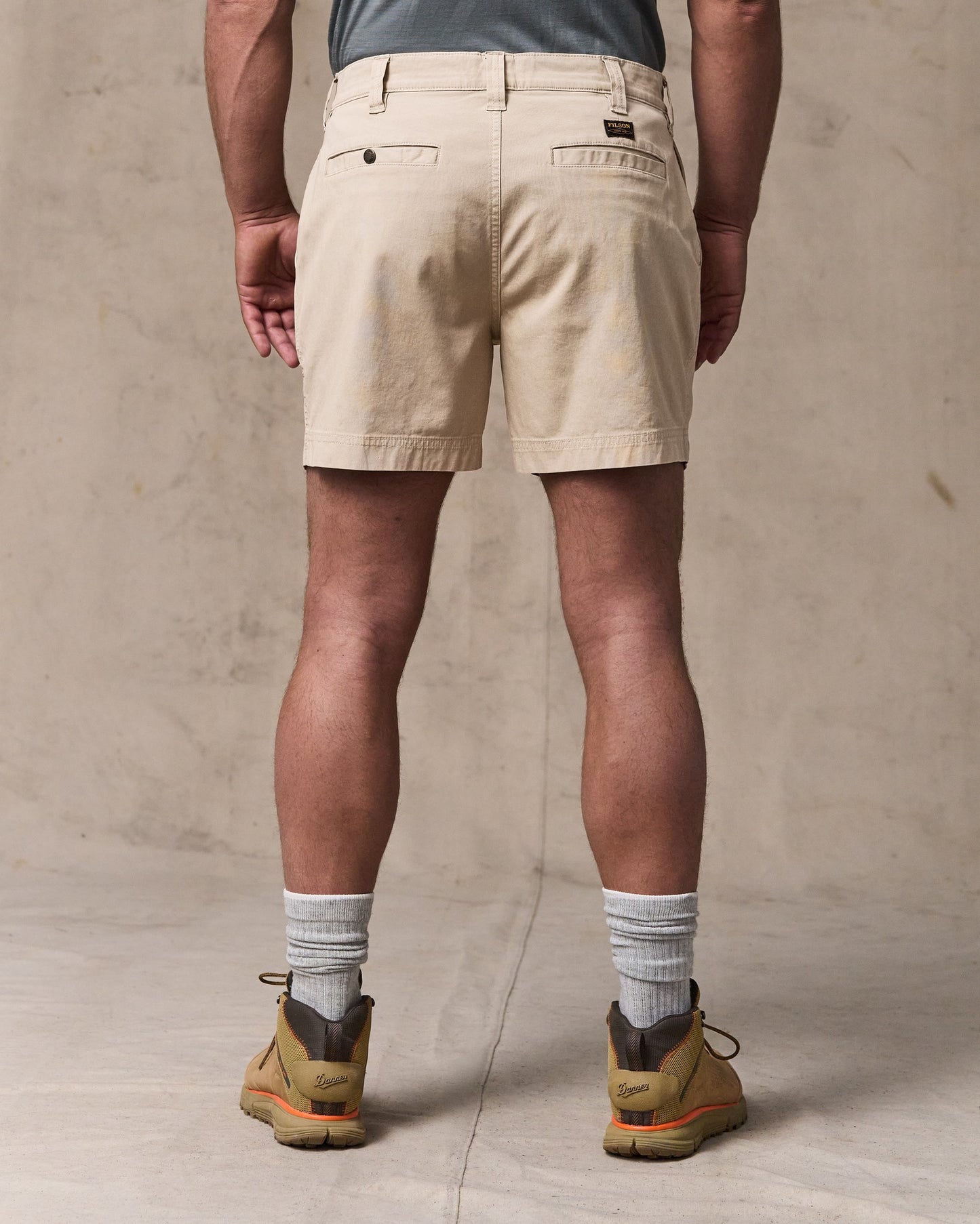 image of a model wearing Filson's Granite Mountain 6" Shorts - Buck Tan