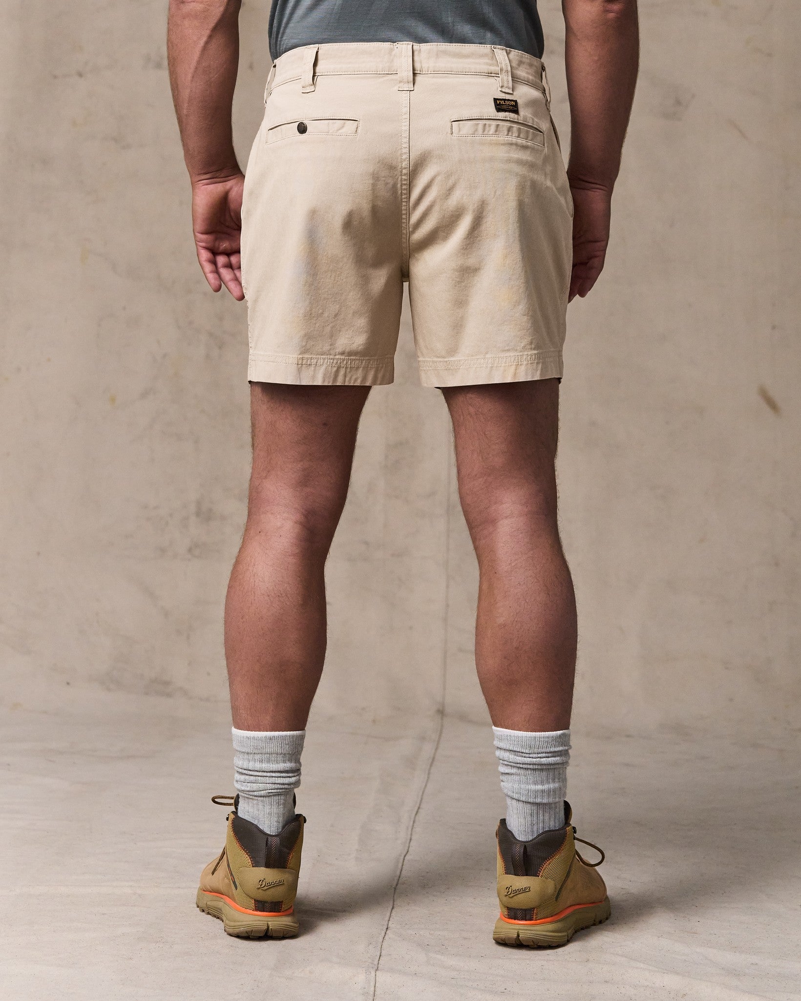 image of a model wearing Filson's Granite Mountain 6" Shorts - Buck Tan